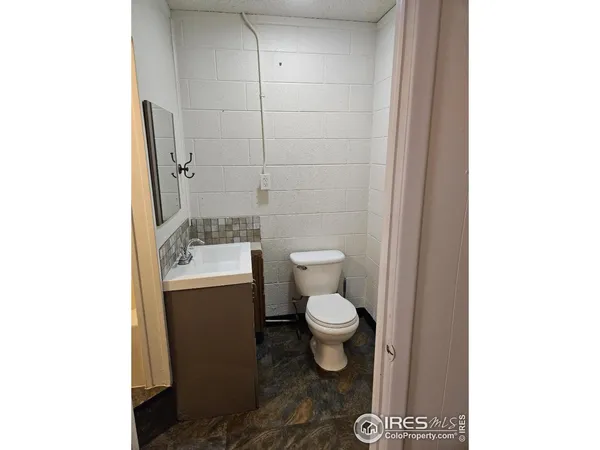 a view of a bathroom with a sink and a window