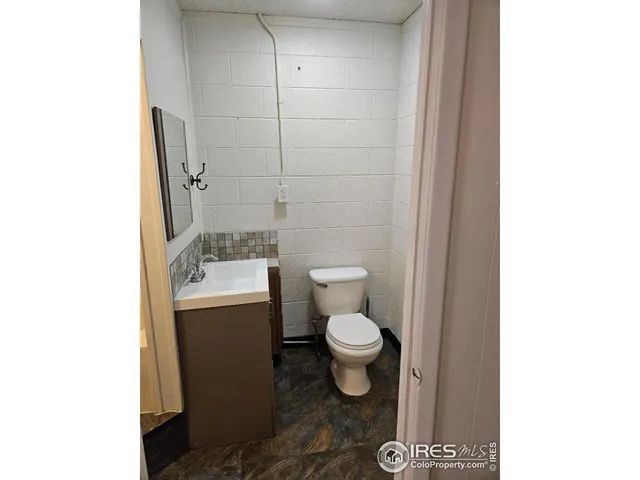 a view of a bathroom with a sink and a window