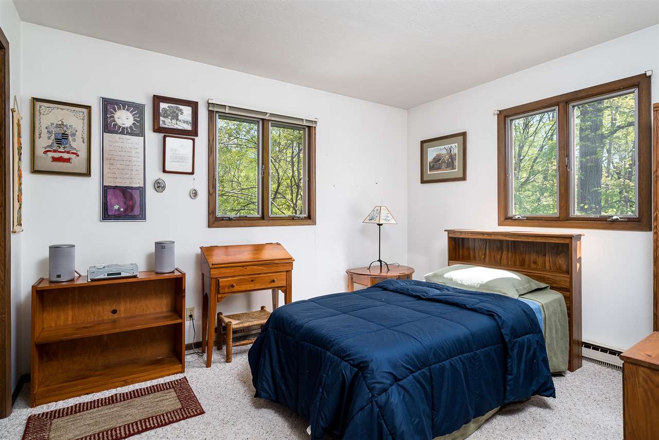 3310 East Whitaker Road Byron, IL 61010 - Photo 11 of 25 a bedroom with a bed and a window