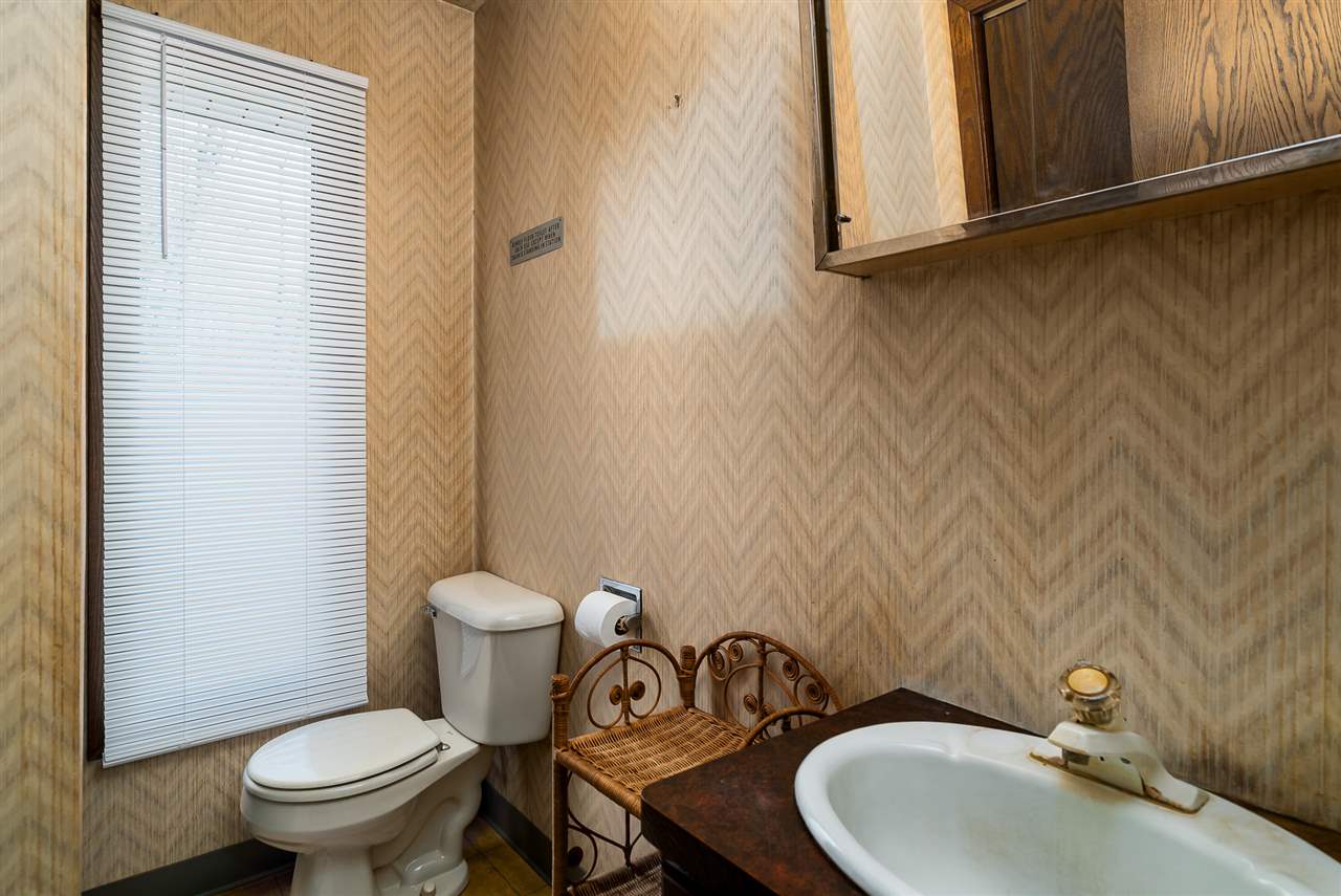 3310 East Whitaker Road Byron, IL 61010 - Photo 13 of 25 a bathroom with a sink and a toilet