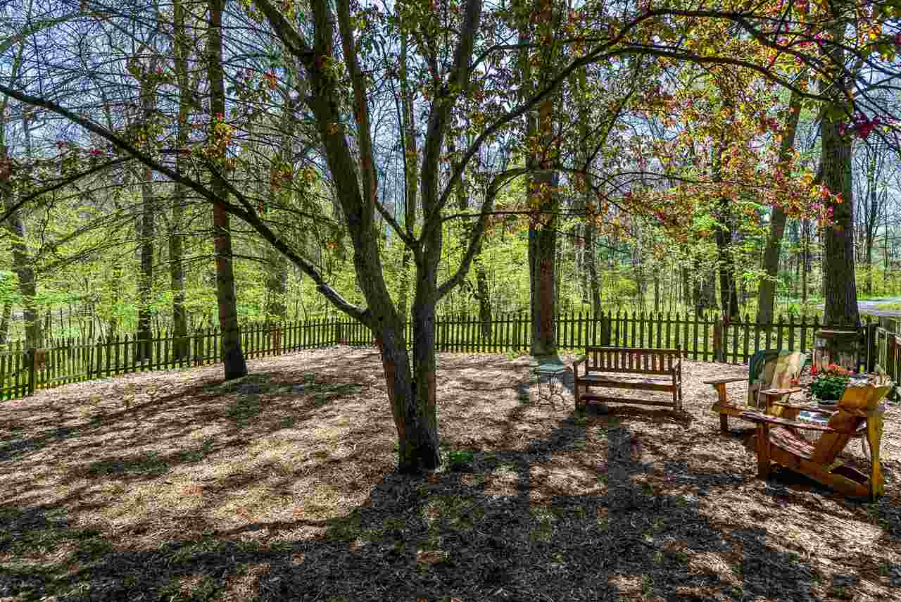 3310 East Whitaker Road Byron, IL 61010 - Photo 18 of 25 a view of a yard with a tree