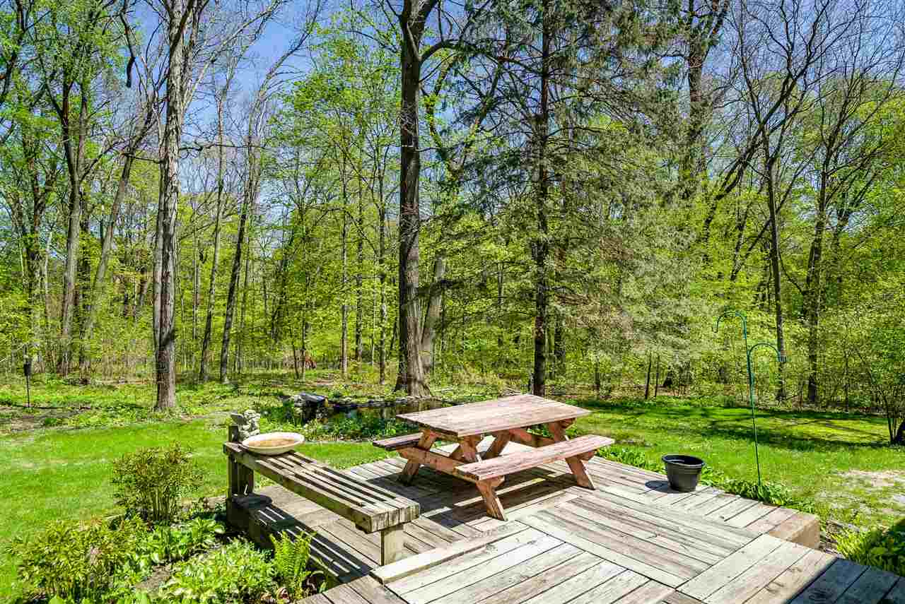 3310 East Whitaker Road Byron, IL 61010 - Photo 20 of 25 a view of a backyard with sitting area
