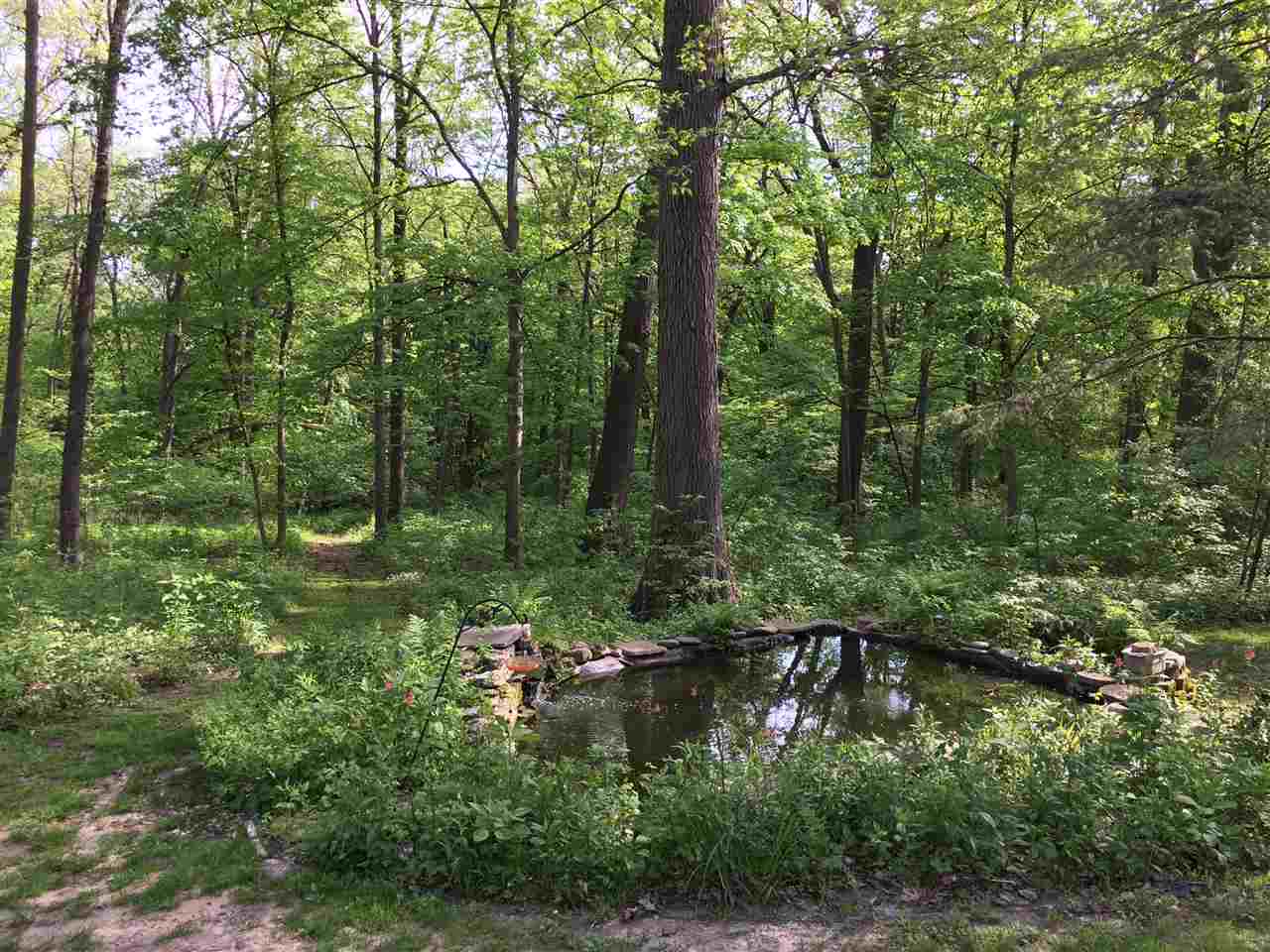3310 East Whitaker Road Byron, IL 61010 - Photo 24 of 25 a backyard of a house with lots of green space