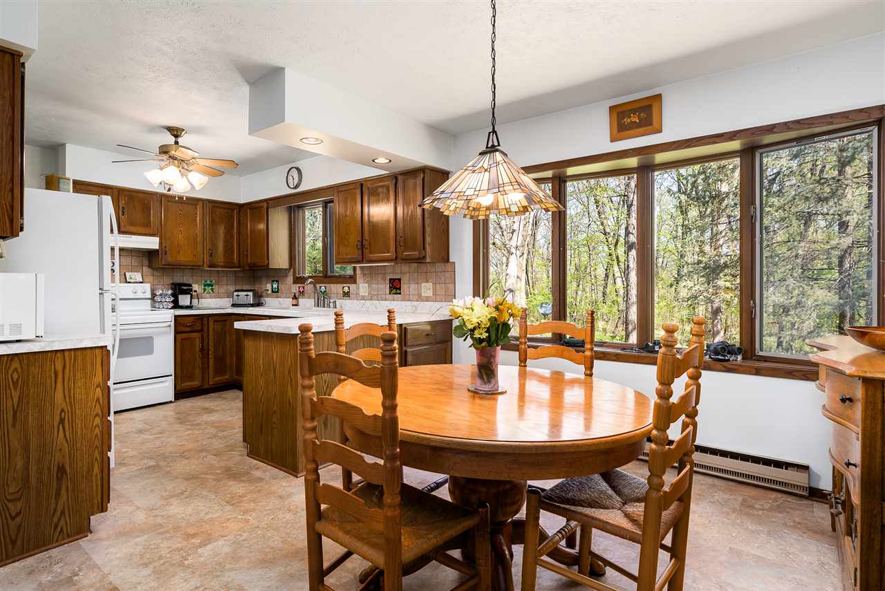 3310 East Whitaker Road Byron, IL 61010 - Photo 5 of 25 a dining table with chairs and window