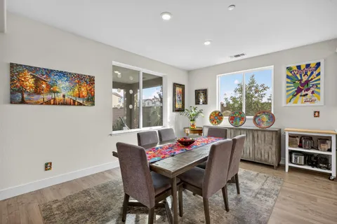 a dining room with furniture and window