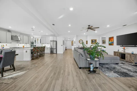 a bathroom with a sink mirror and toilet