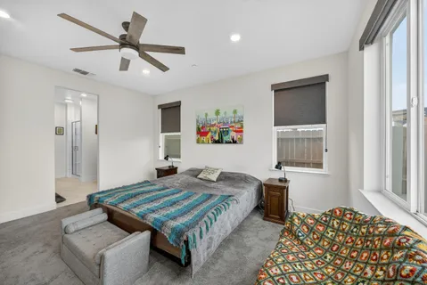 a view of walk in closet with clothes