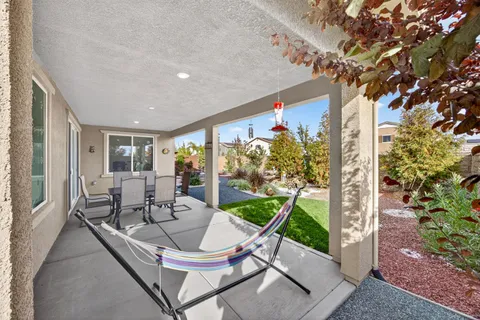 an aerial view of a house with garden space and street view
