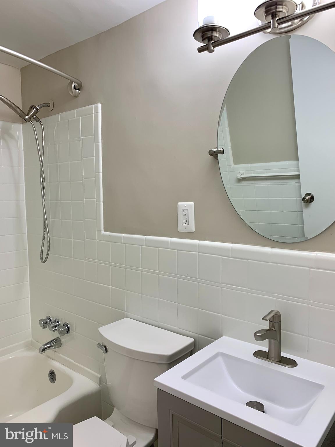 2615 13th Road South Arlington, VA 22204 - Photo 17 of 41 a bathroom with a sink a toilet and shower