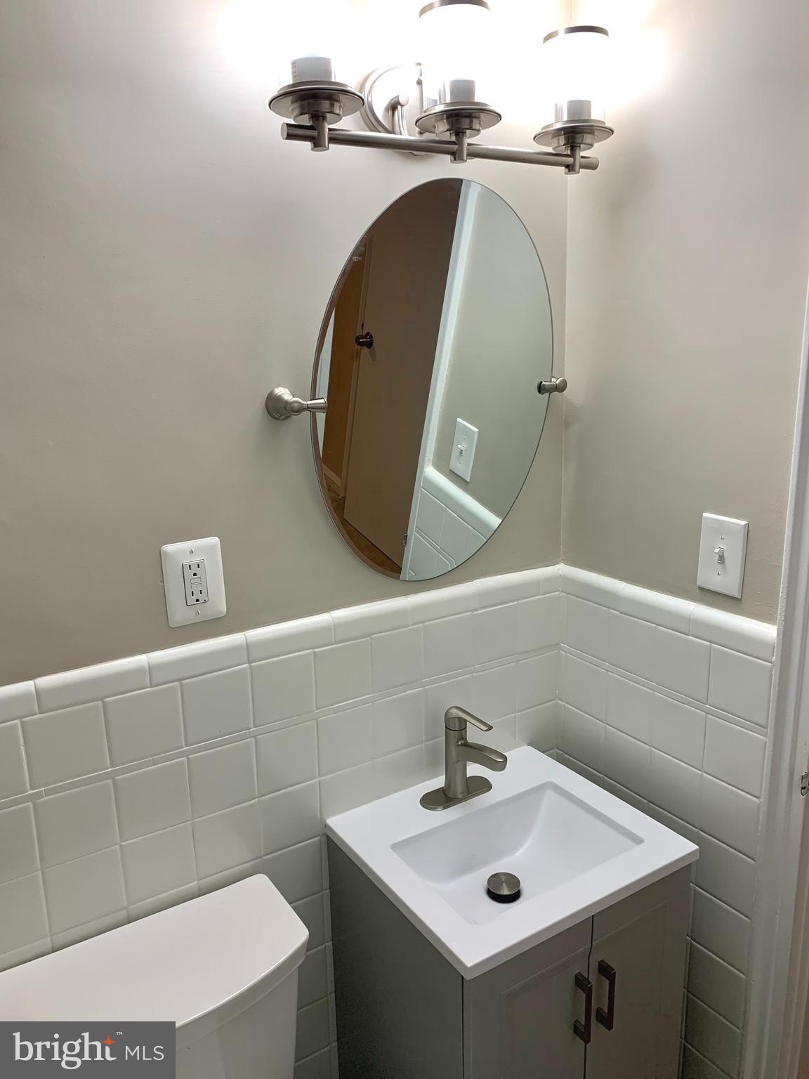 2615 13th Road South Arlington, VA 22204 - Photo 18 of 41 a bathroom with a sink and vanity