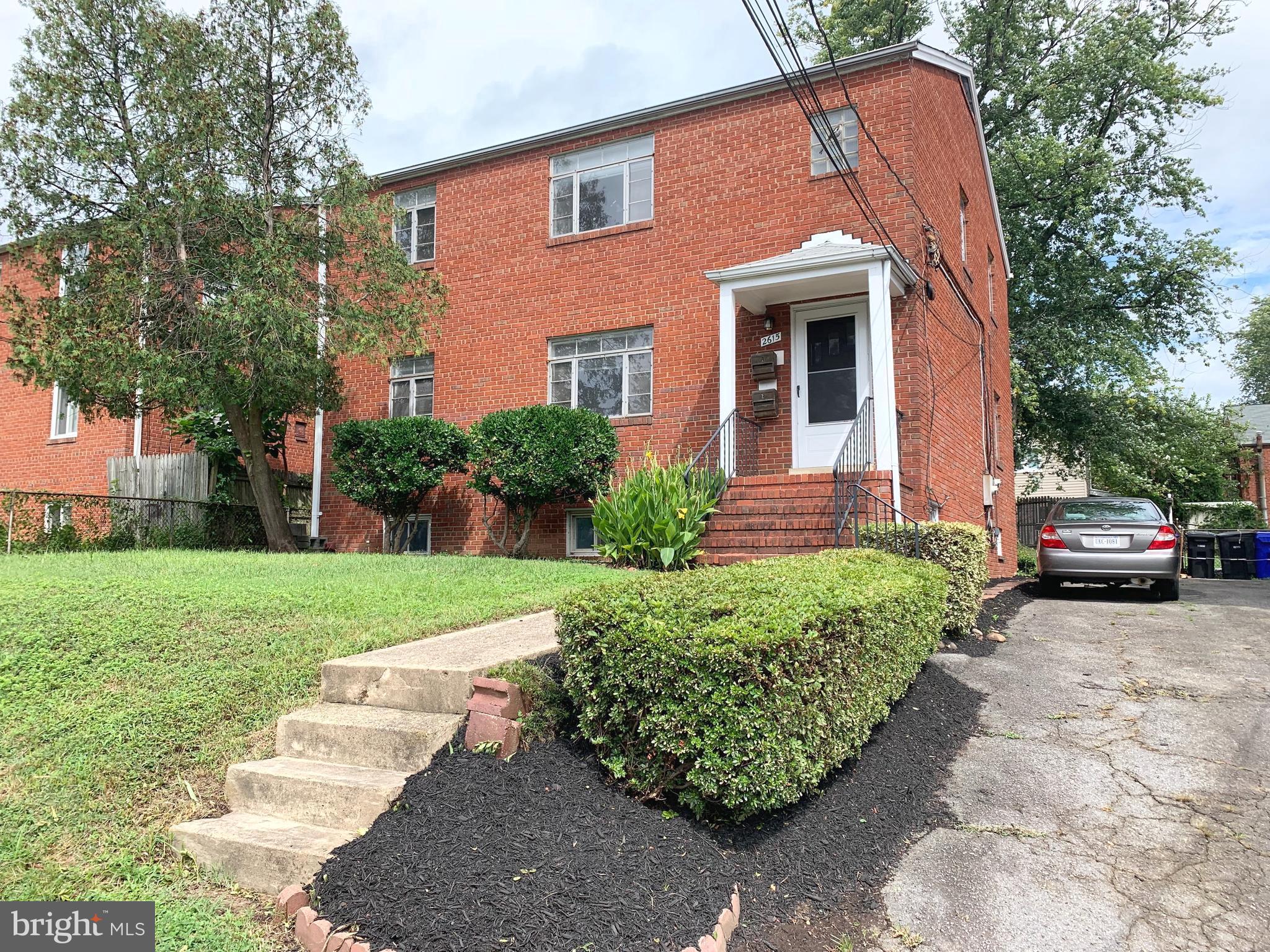 2615 13th Road South Arlington, VA 22204 - Photo 2 of 41 a front view of a house with garden
