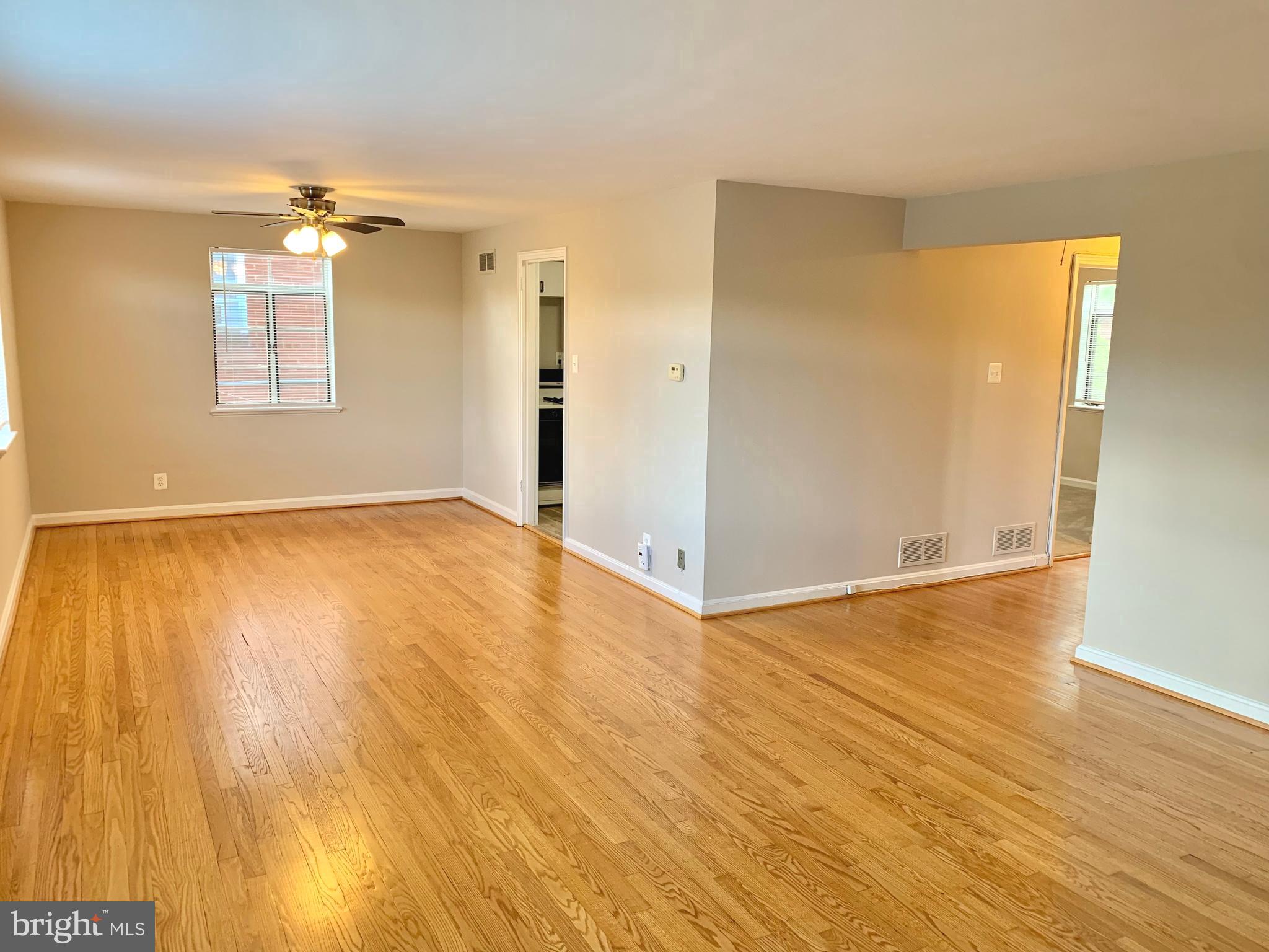 2615 13th Road South Arlington, VA 22204 - Photo 29 of 41 wooden floor in an empty room with a window