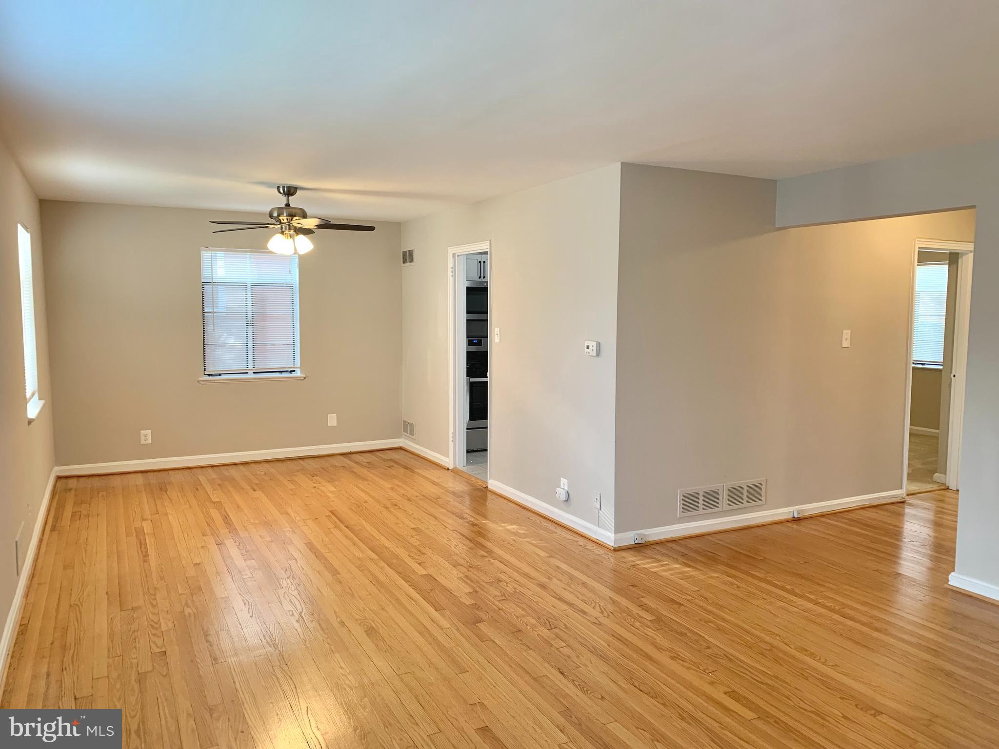 2615 13th Road South Arlington, VA 22204 - Photo 3 of 41 wooden floor in an empty room with a window