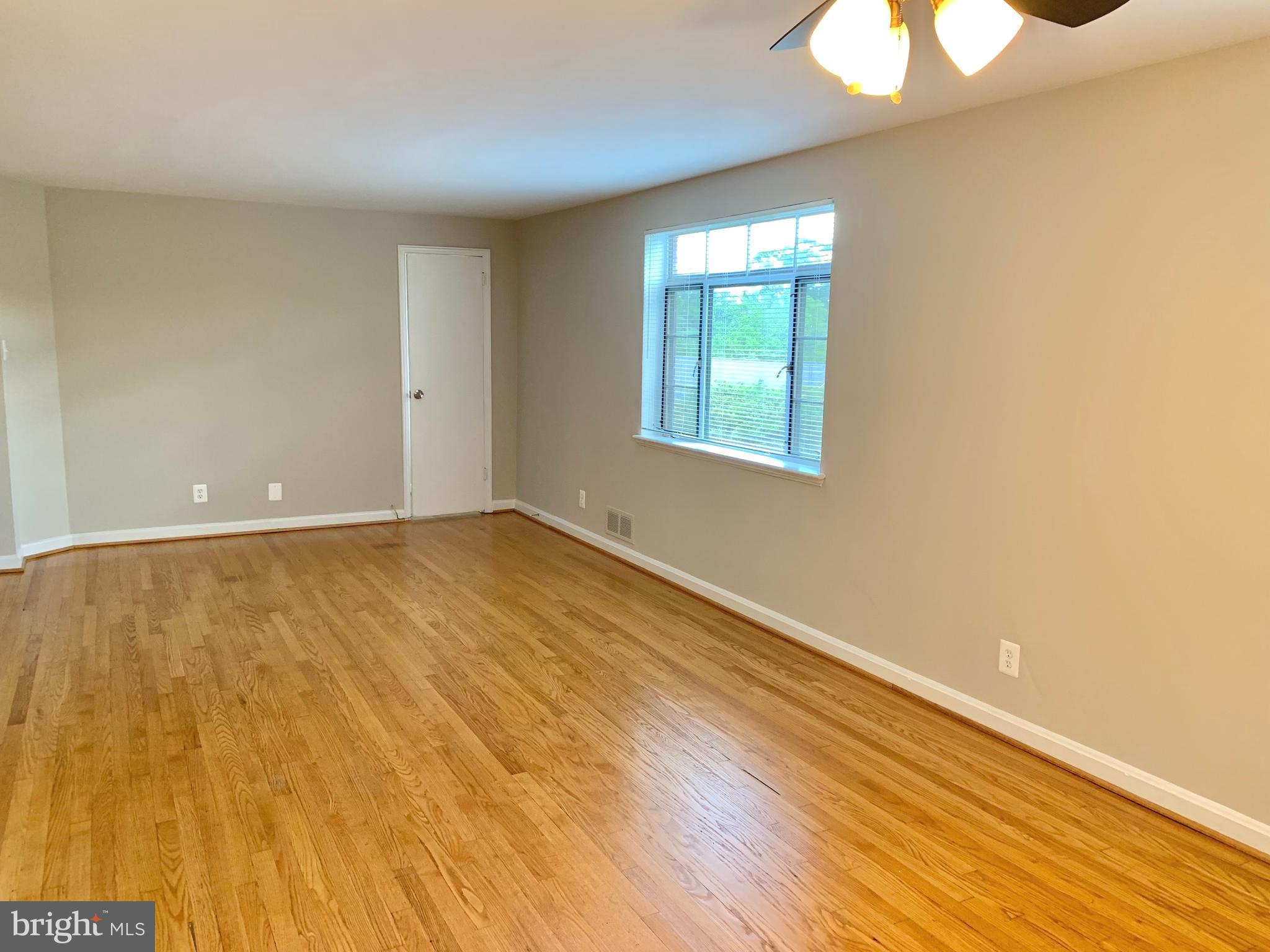 2615 13th Road South Arlington, VA 22204 - Photo 35 of 41 an empty room with wooden floor and windows
