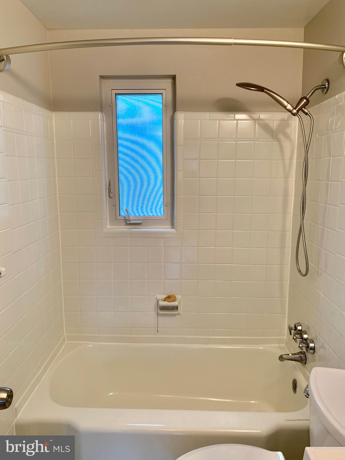 2615 13th Road South Arlington, VA 22204 - Photo 39 of 41 a bathroom with a shower and a bath tub