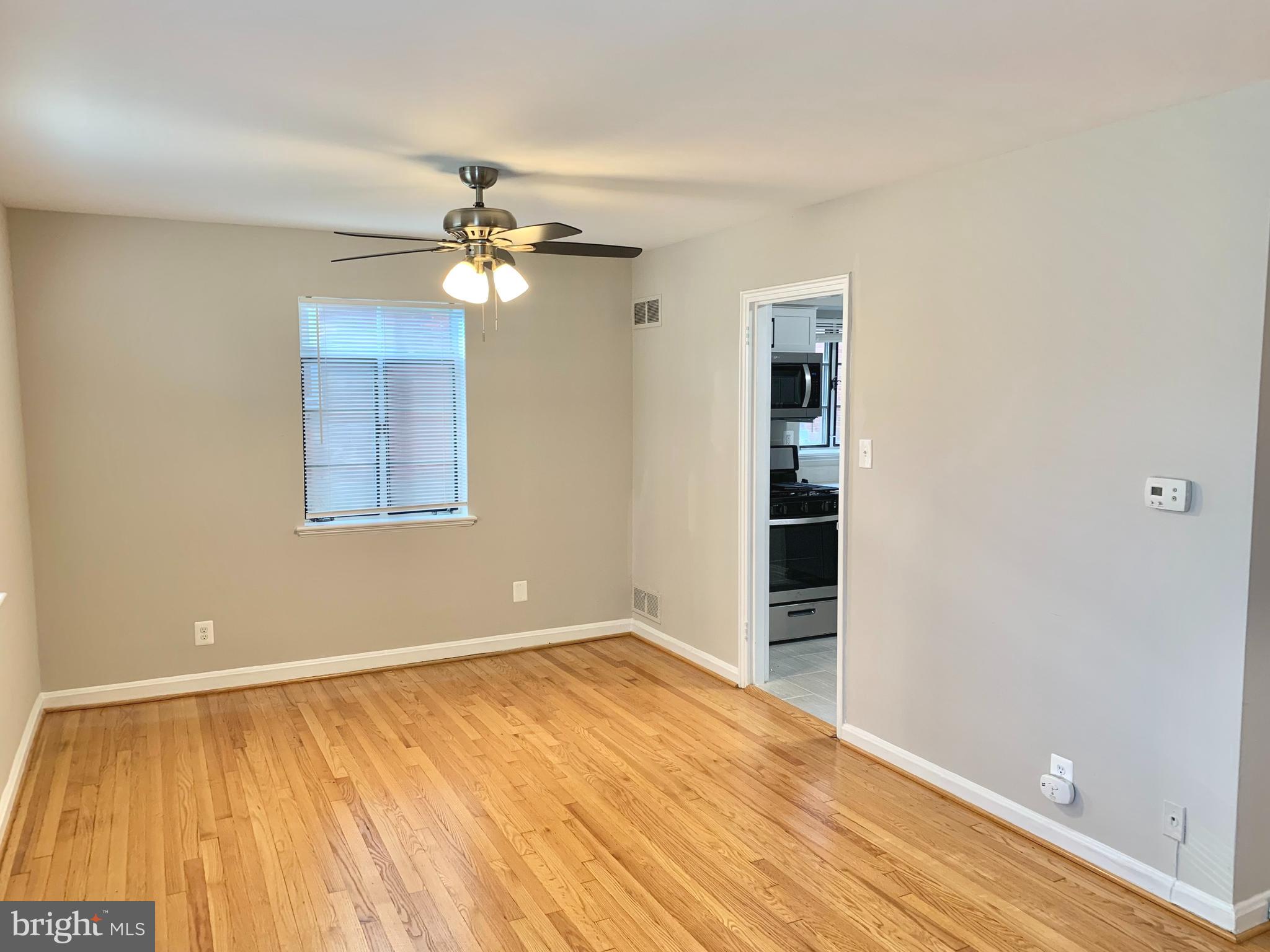 2615 13th Road South Arlington, VA 22204 - Photo 5 of 41 wooden floor in an empty room with a window