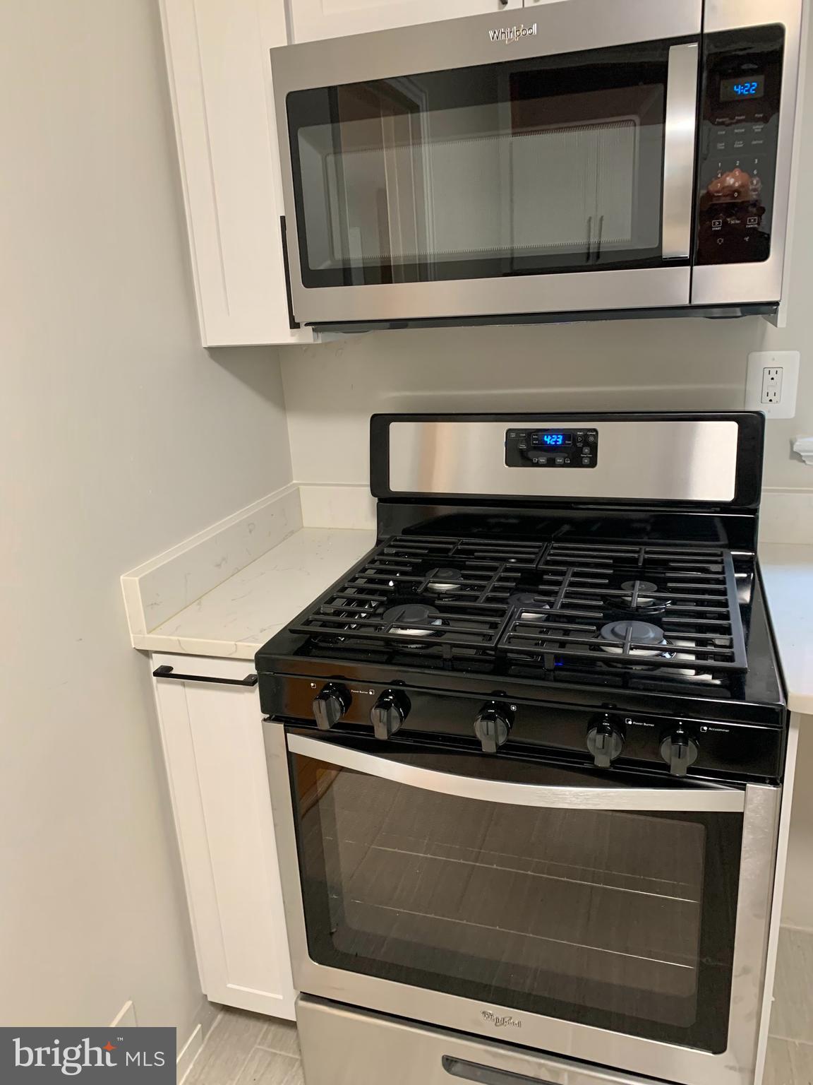 2615 13th Road South Arlington, VA 22204 - Photo 8 of 41 a stove top oven sitting inside of a kitchen