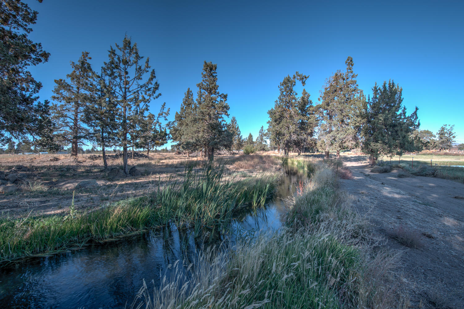 22222 Erickson Road Bend, OR 97701 - Photo 92 of 100 Canal flows to back of property