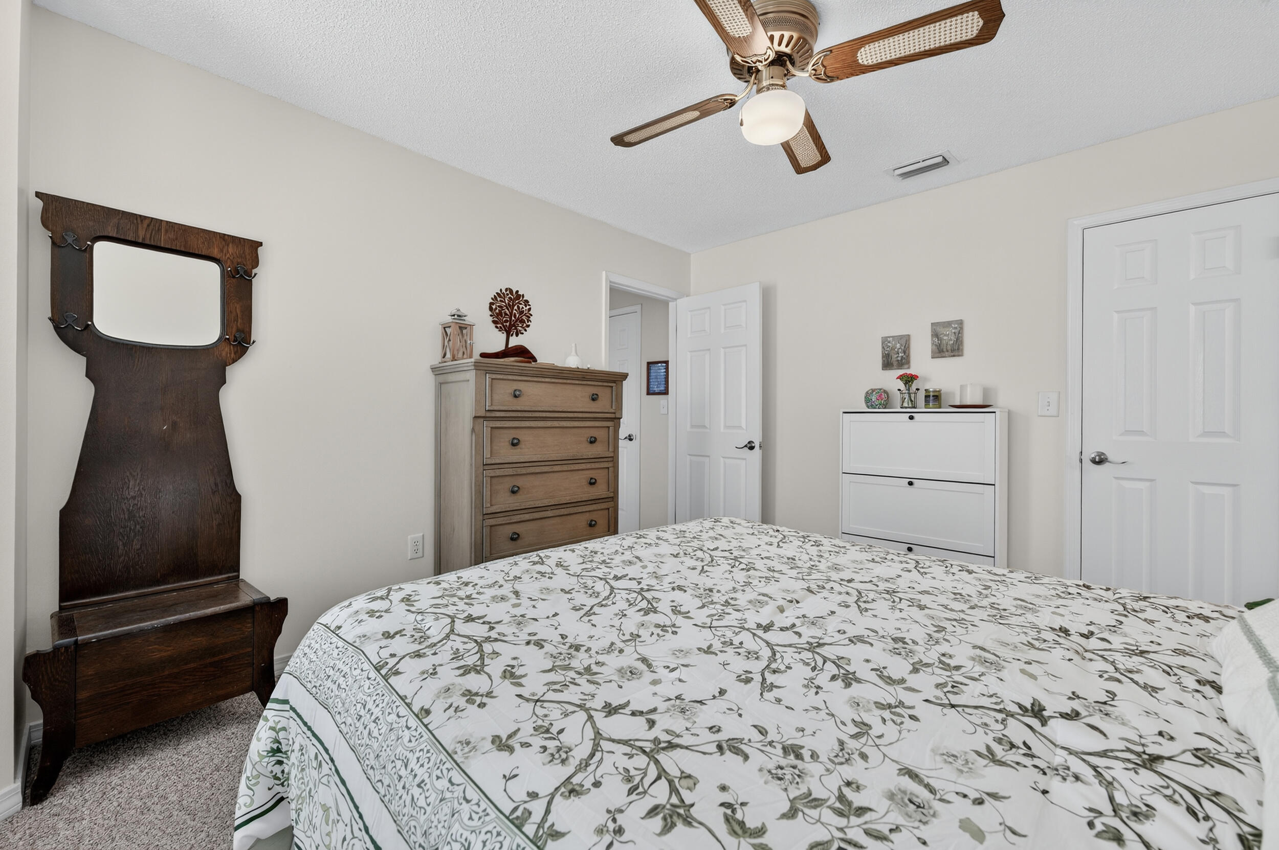 105 Cedar Point Road Crestview, FL 32539 - Photo 11 of 53 a bedroom with a bed and a dresser