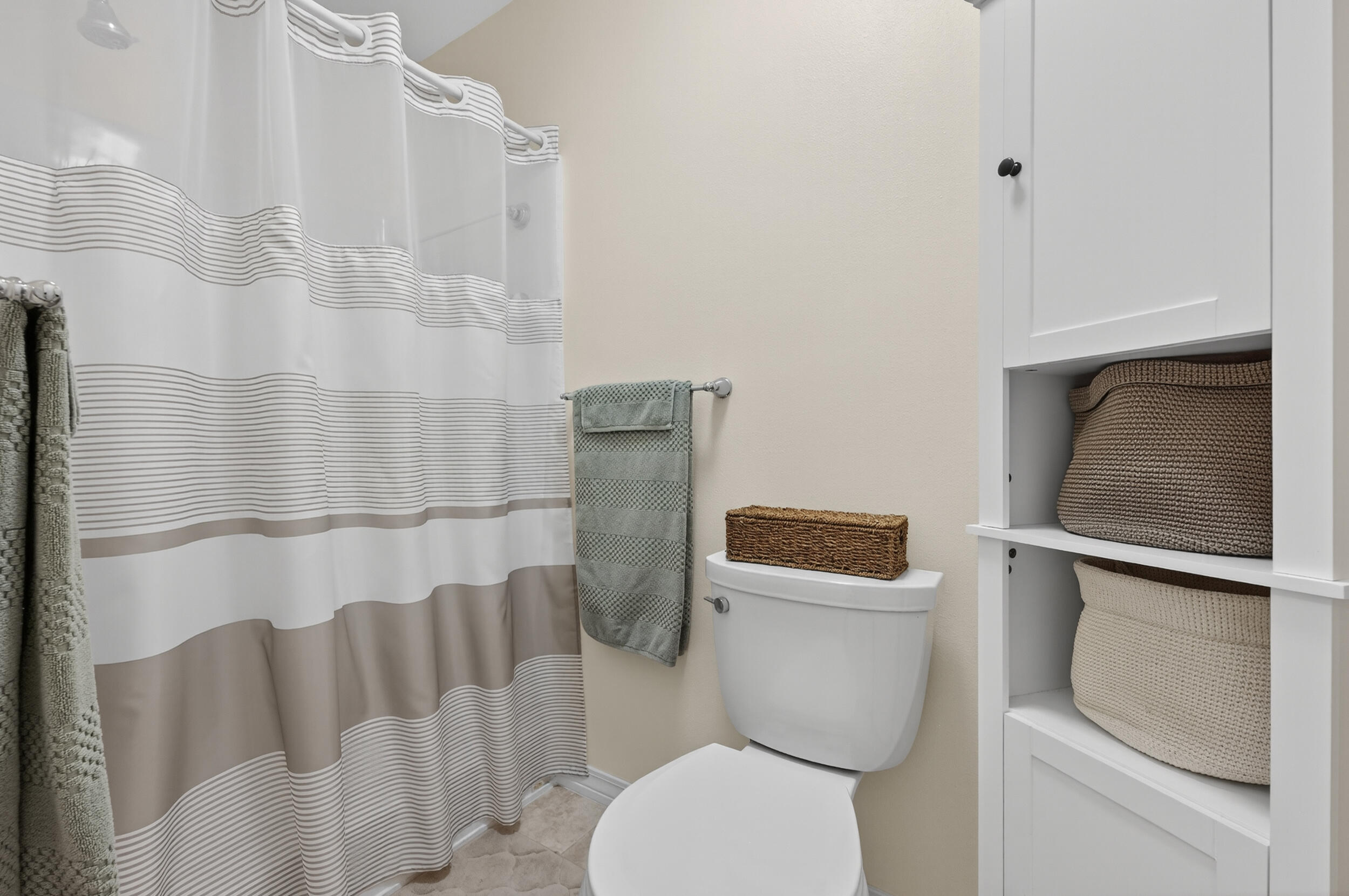 105 Cedar Point Road Crestview, FL 32539 - Photo 14 of 53 a white toilet sitting next to a shower curtain
