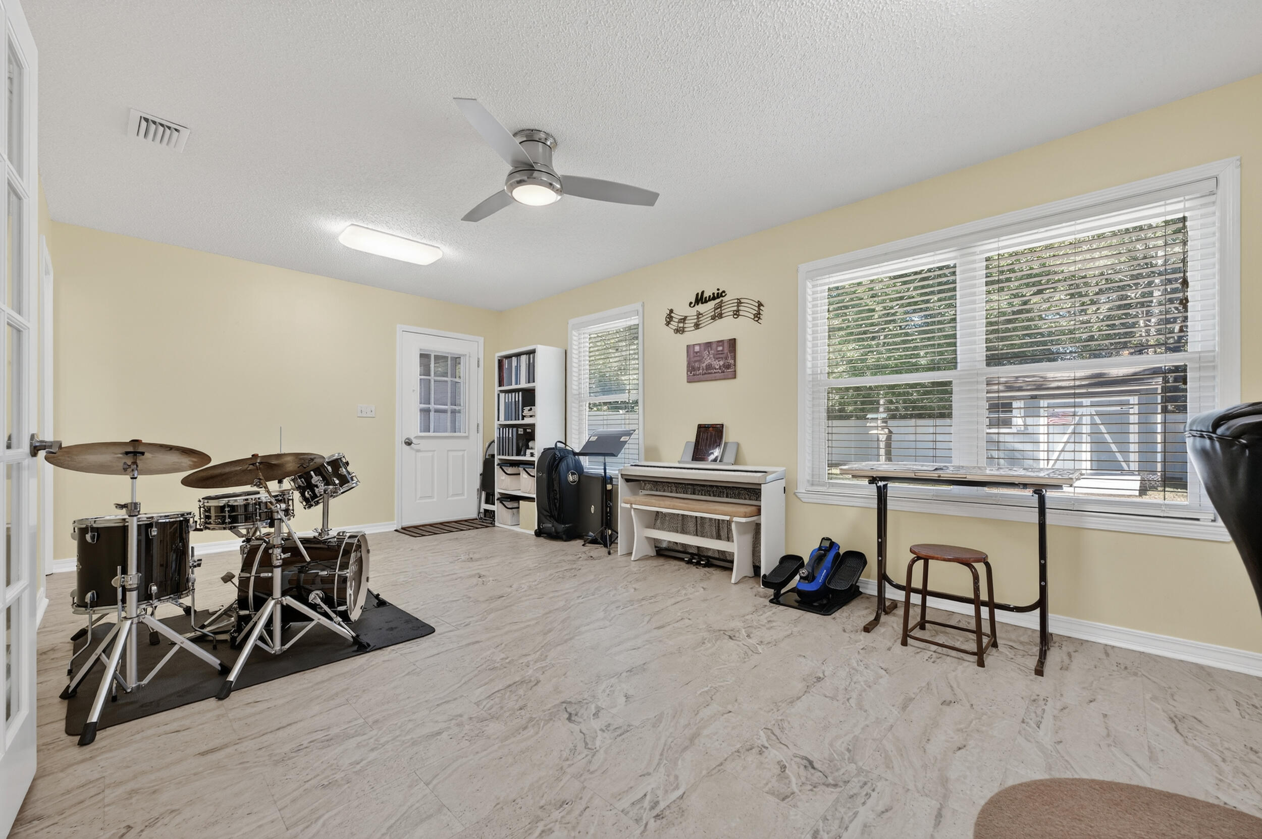 105 Cedar Point Road Crestview, FL 32539 - Photo 31 of 53 a view of a workspace with furniture and a livingroom
