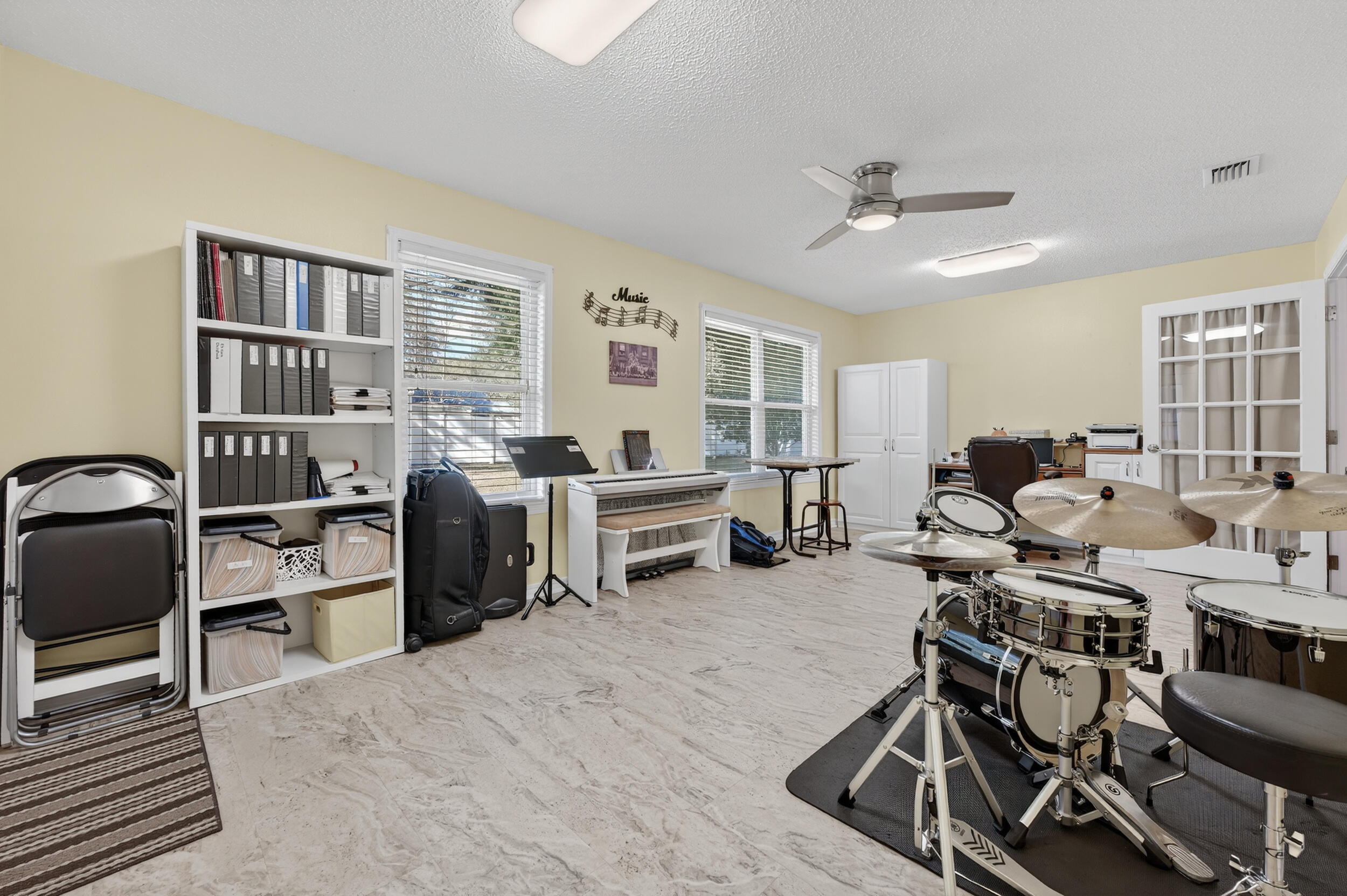105 Cedar Point Road Crestview, FL 32539 - Photo 34 of 53 a living room with furniture a window and gym equipment