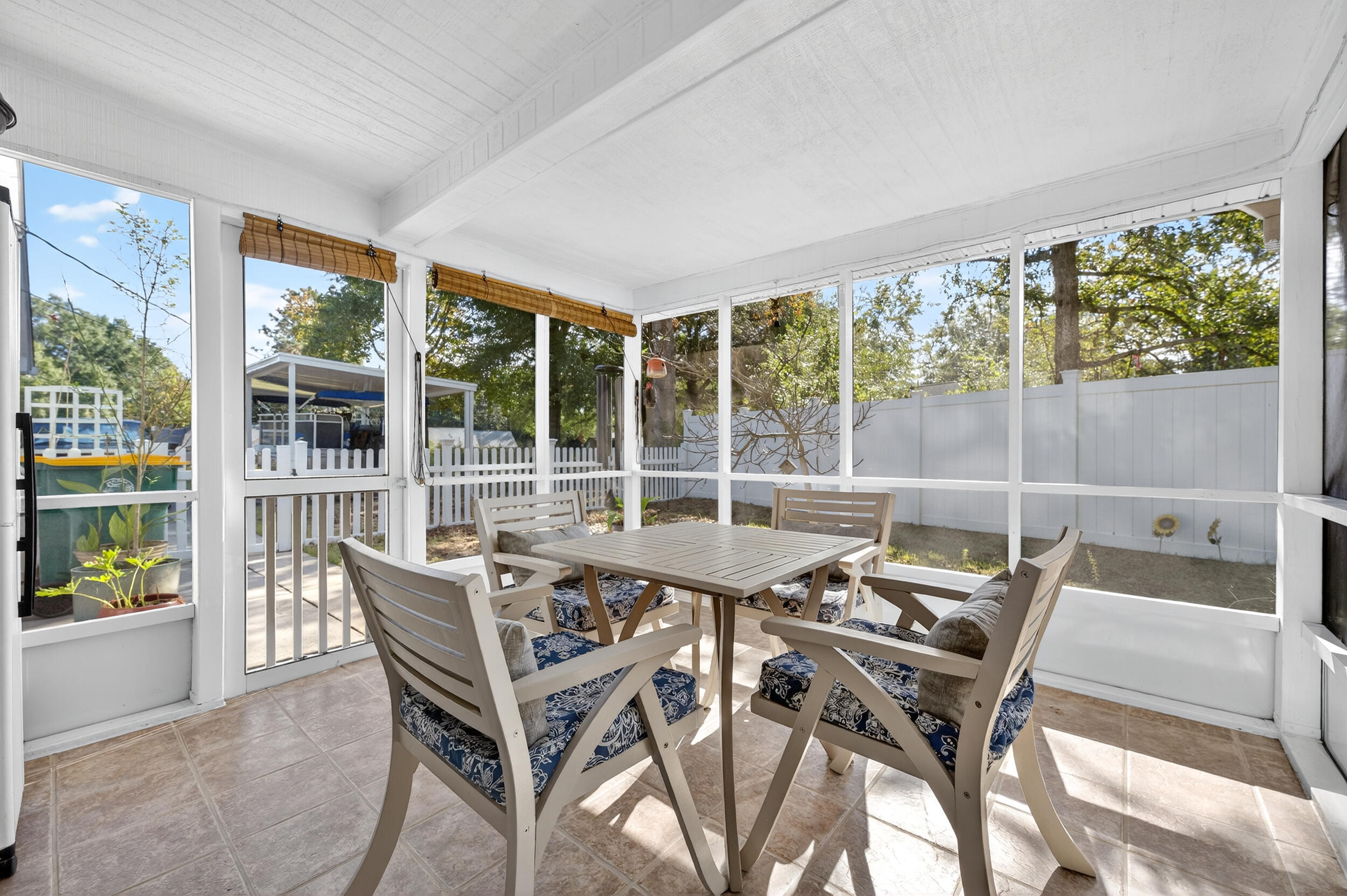 105 Cedar Point Road Crestview, FL 32539 - Photo 38 of 53 a view of a dining room with furniture large windows and wooden floor