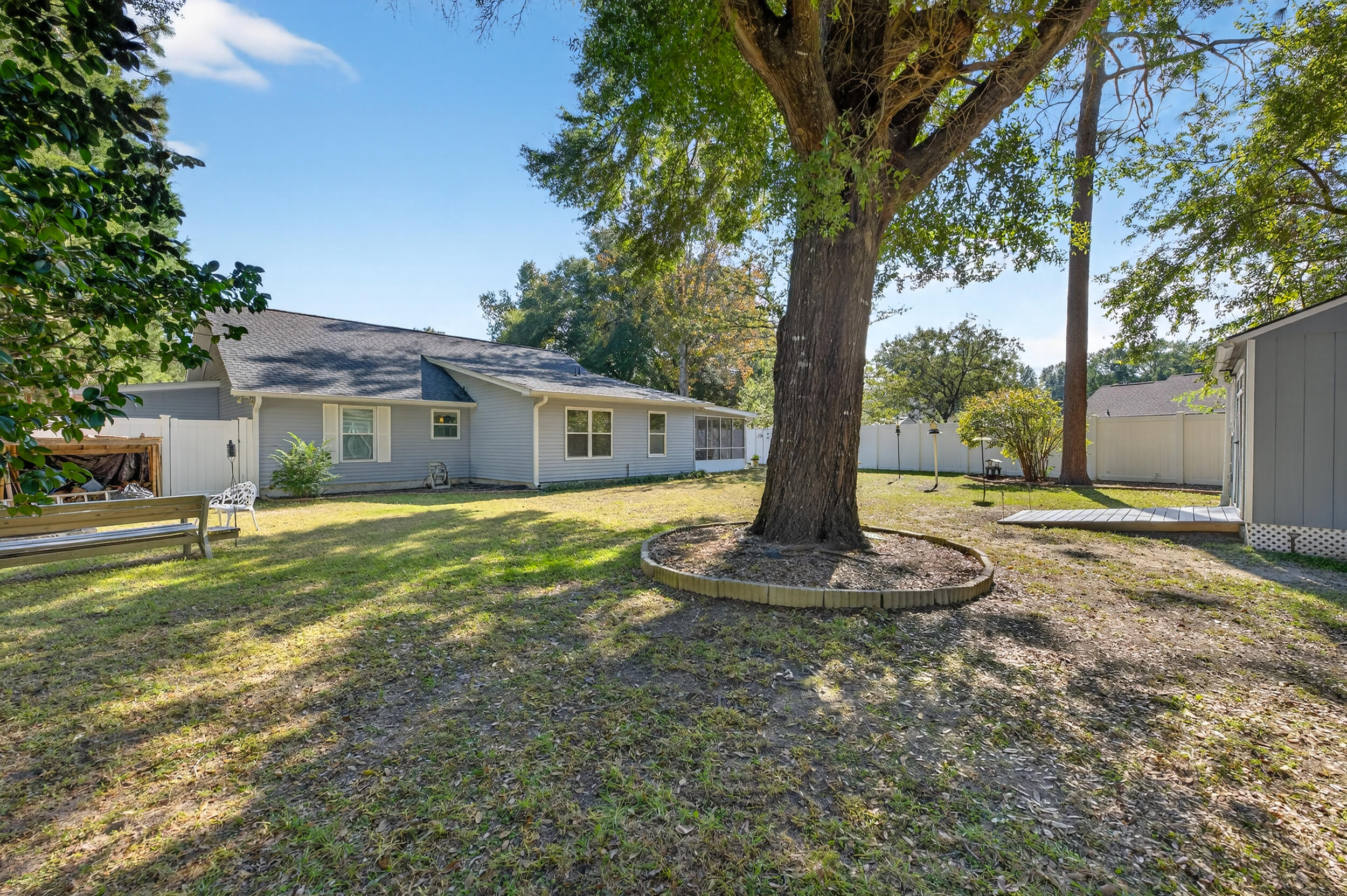 105 Cedar Point Road Crestview, FL 32539 - Photo 47 of 53 a front view of a house with a yard balcony and tree