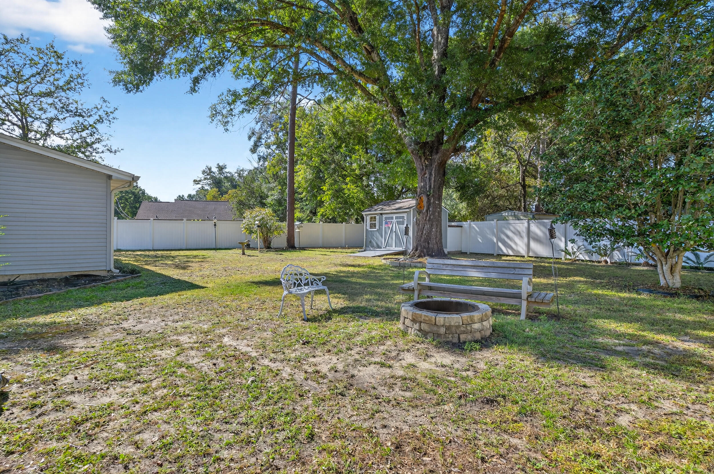 105 Cedar Point Road Crestview, FL 32539 - Photo 48 of 53 a backyard of a house with lots of green space