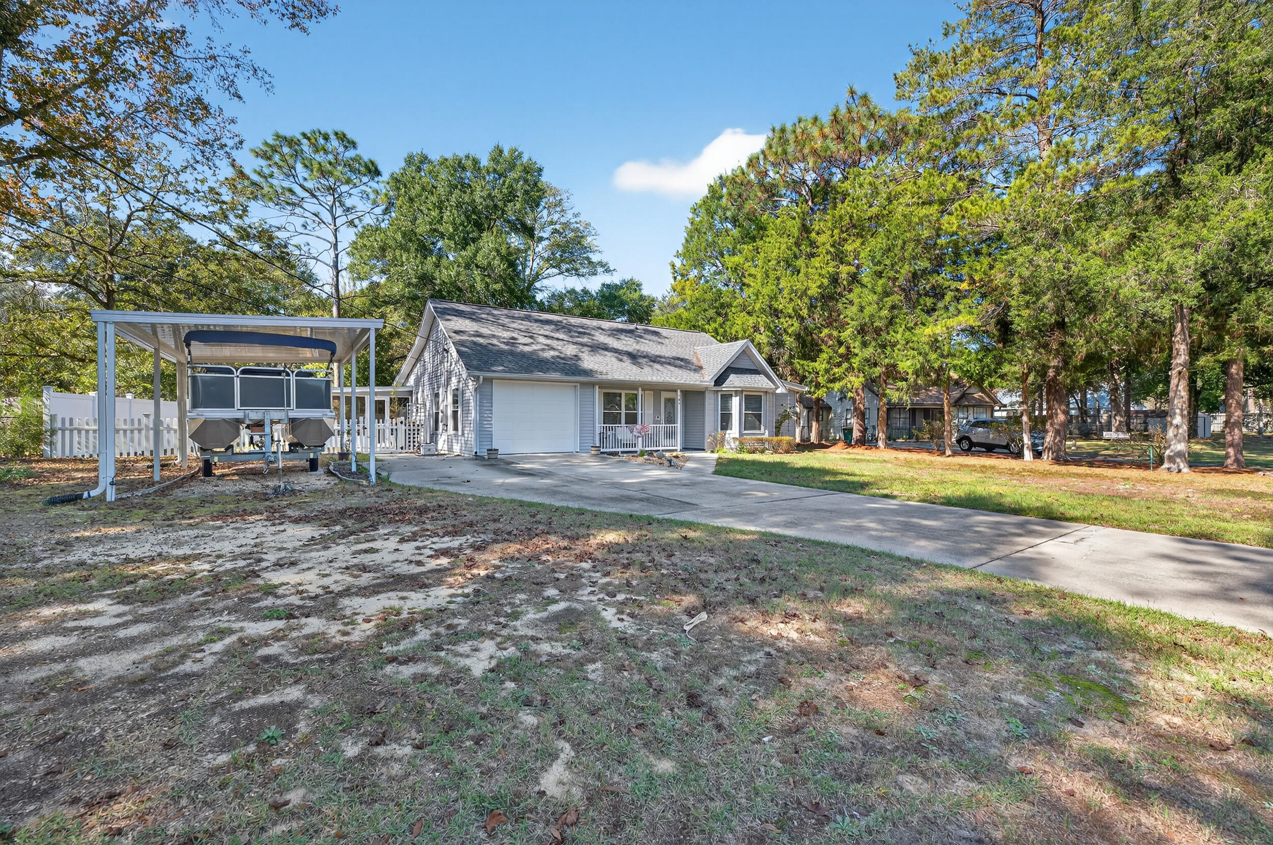 105 Cedar Point Road Crestview, FL 32539 - Photo 7 of 53 a view of house with yard and sitting area