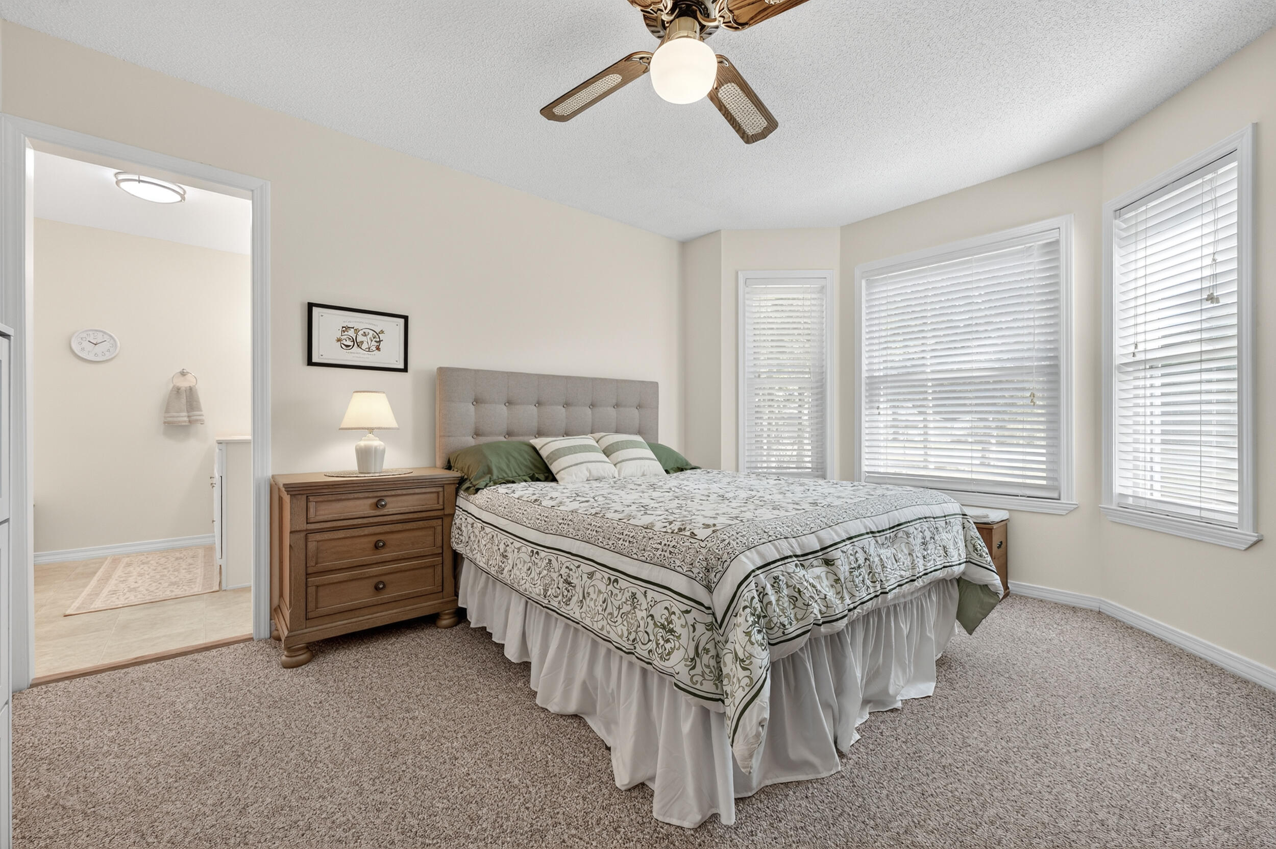 105 Cedar Point Road Crestview, FL 32539 - Photo 8 of 53 a bedroom with a bed and a chandelier