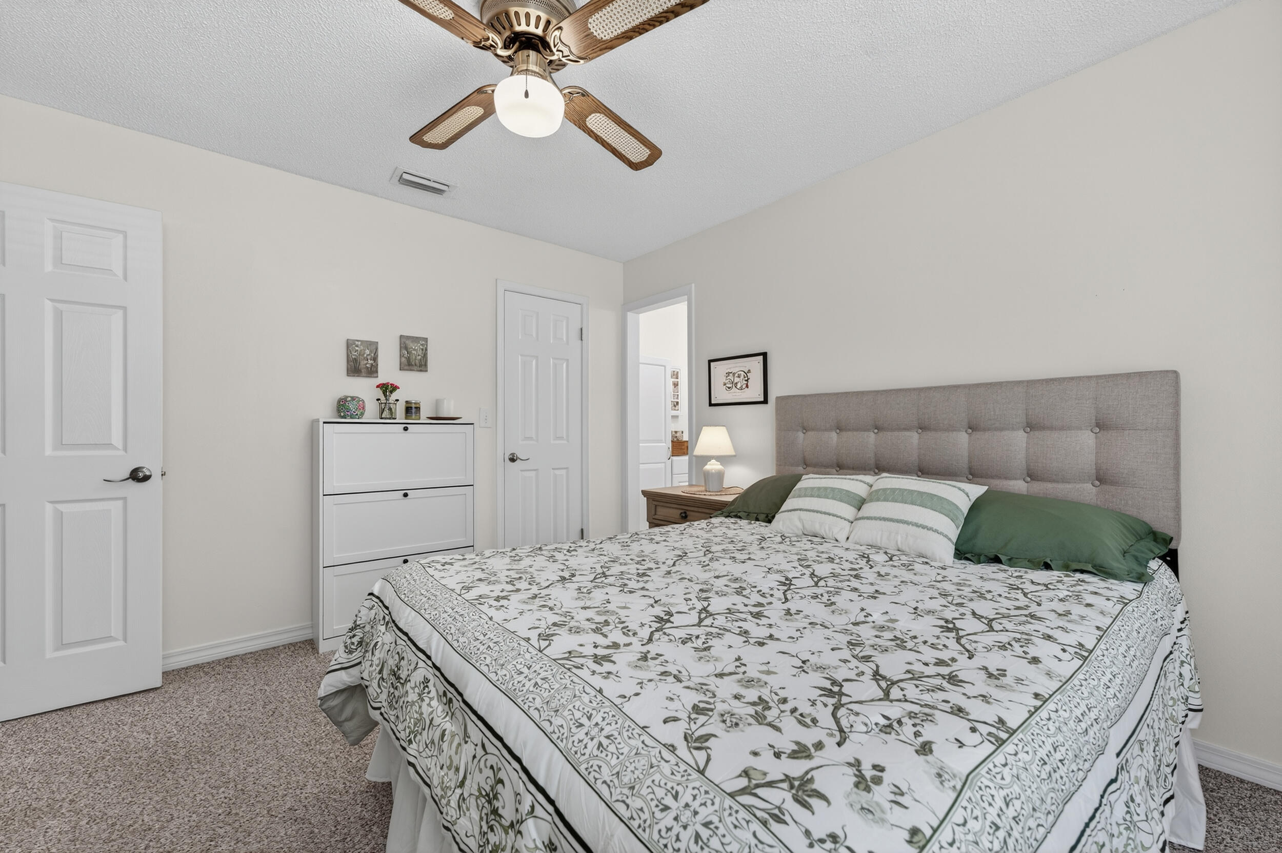 105 Cedar Point Road Crestview, FL 32539 - Photo 10 of 53 a bedroom with a bed and cabinets