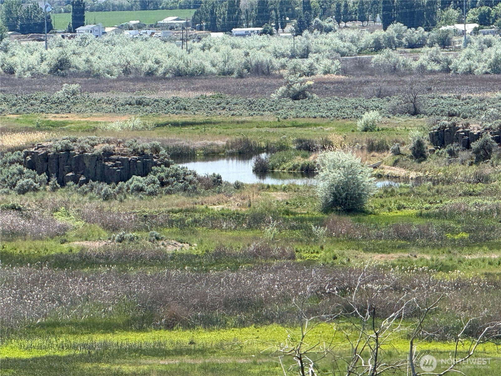 8708 Rd K Northeast Moses Lake, WA 98837 - Photo 29 of 40 a view of a garden with a lake