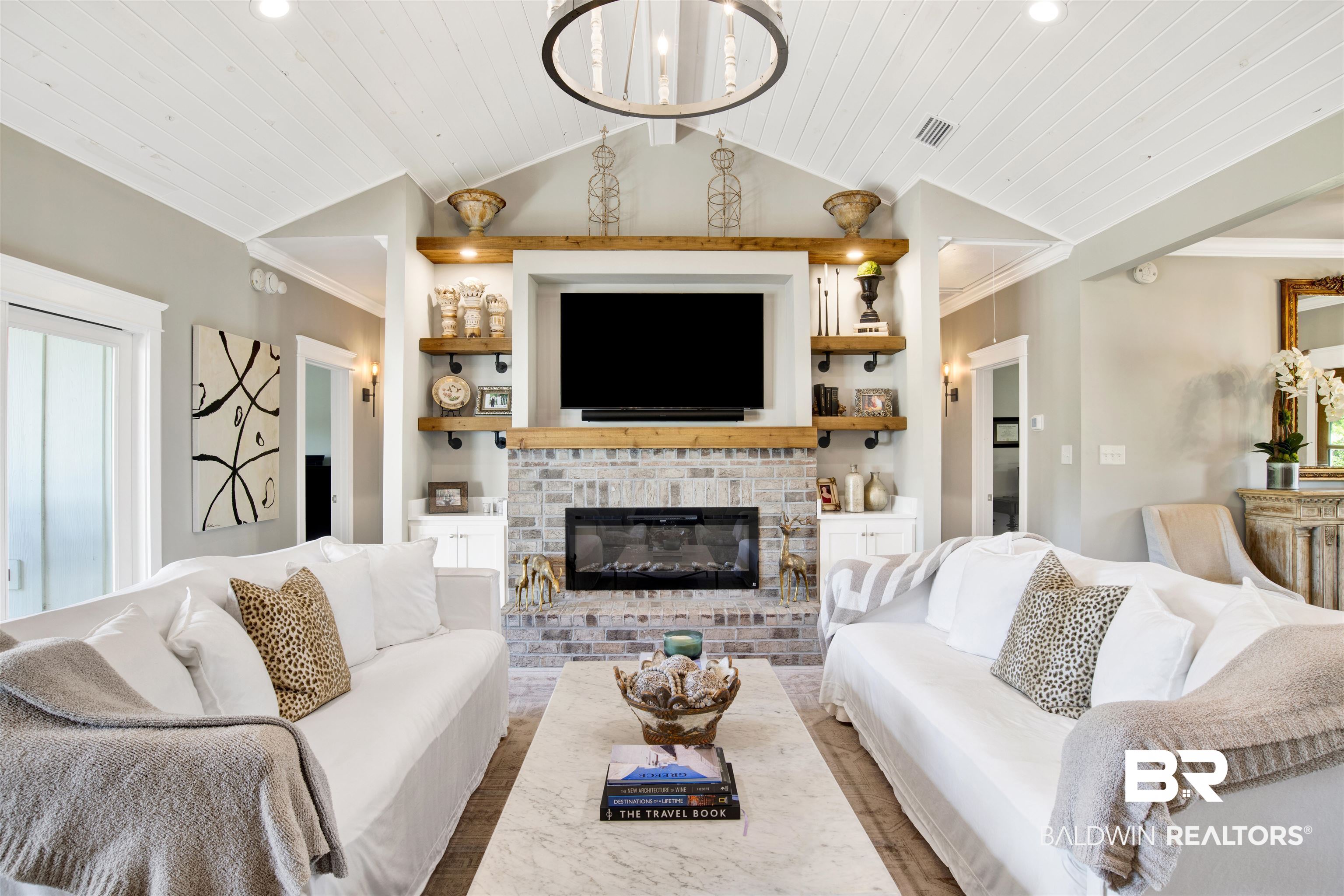 21621 Veranda Boulevard Fairhope, AL 36532 - Photo 20 of 51 Living area featuring visible vents, ornamental molding, lofted ceiling, a fireplace, and wood ceiling