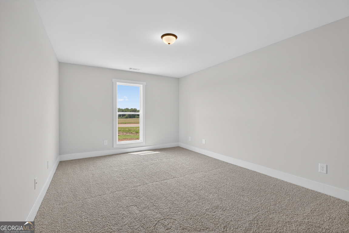 206 Airport Road, Unit 11 Canon, GA 30520 - Photo 29 of 34 a view of an empty room with a window