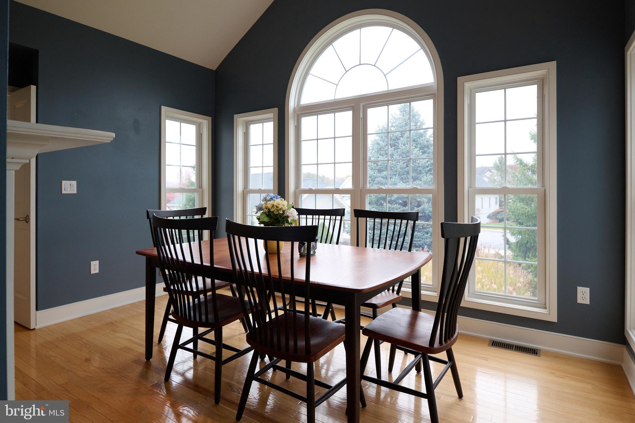 3296 Shellers Bend, Unit 144 State College, PA 16801 - Photo 17 of 48 a view of a dining room with furniture window and wooden floor