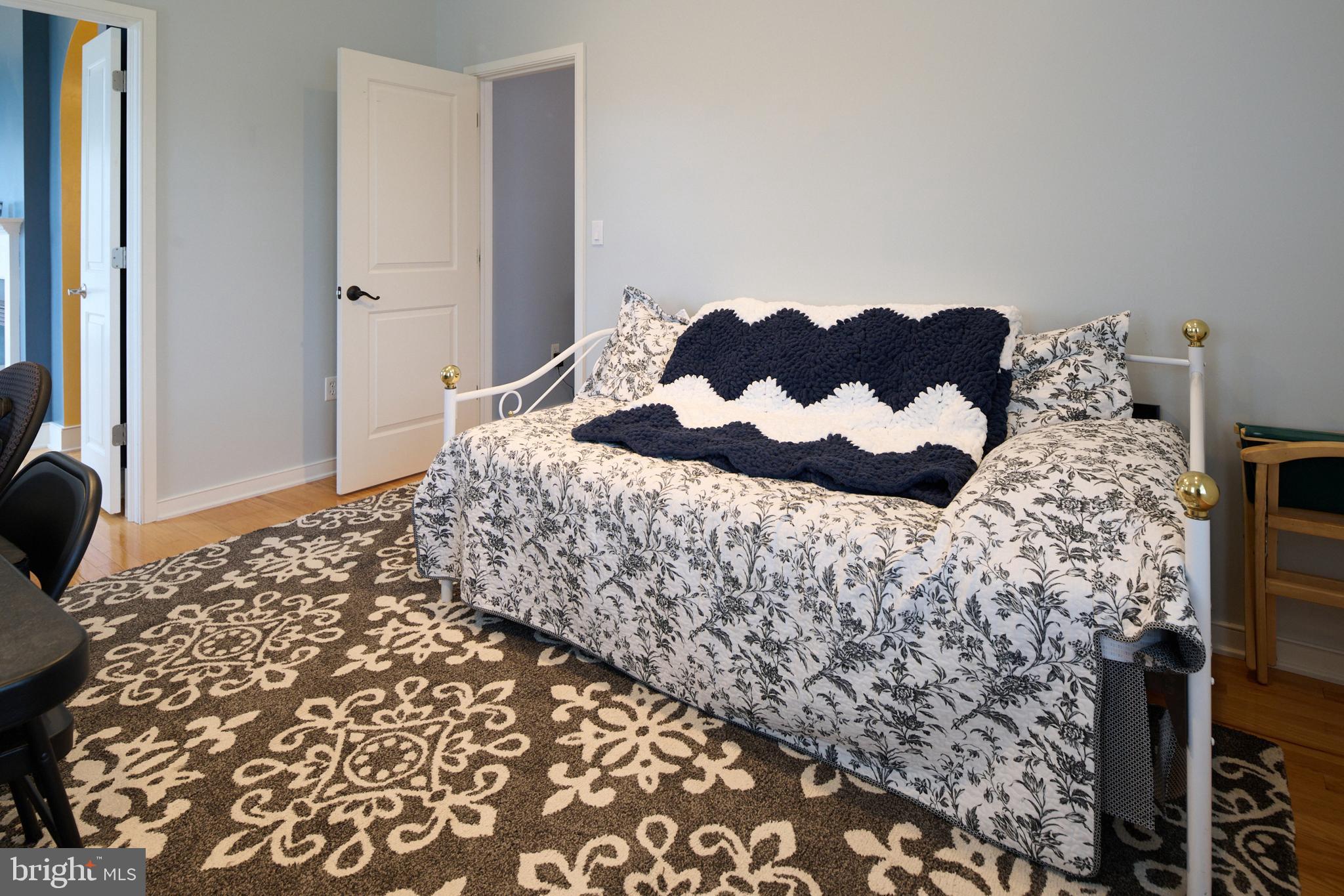 3296 Shellers Bend, Unit 144 State College, PA 16801 - Photo 22 of 48 a bedroom with a bed and a chair