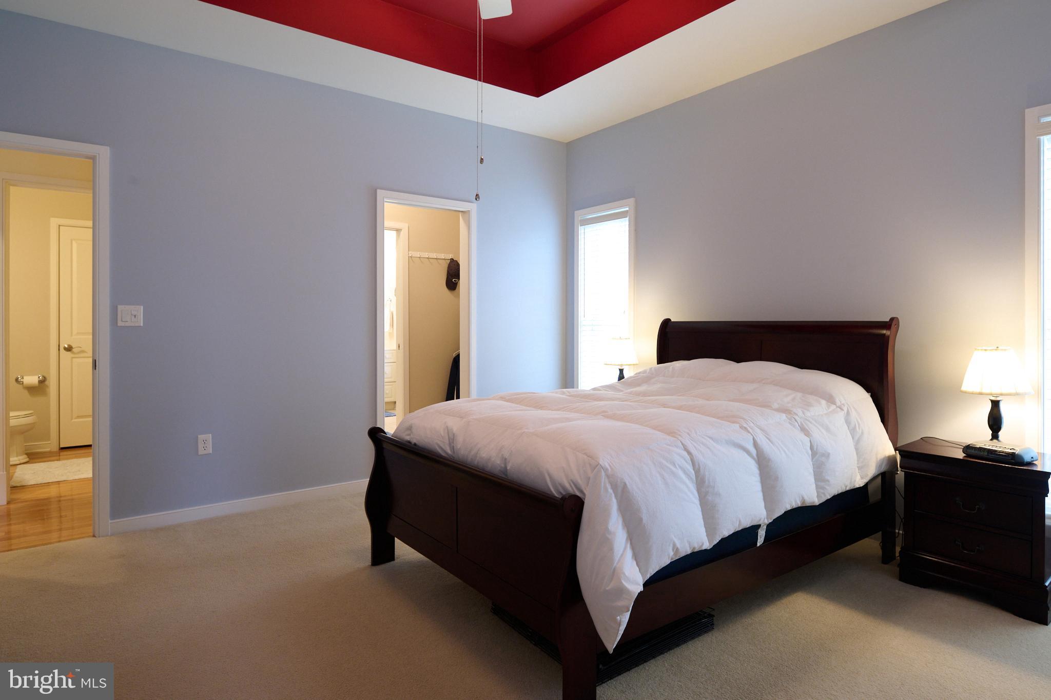 3296 Shellers Bend, Unit 144 State College, PA 16801 - Photo 23 of 48 a bed sitting in a bedroom next to a window