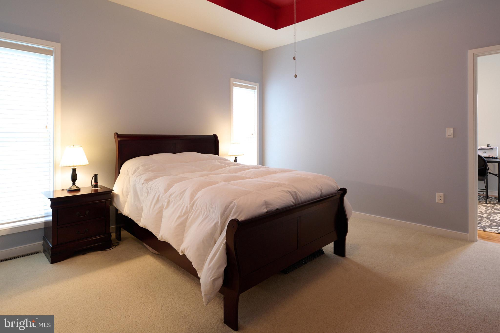 3296 Shellers Bend, Unit 144 State College, PA 16801 - Photo 24 of 48 a bed sitting in a bedroom next to a window