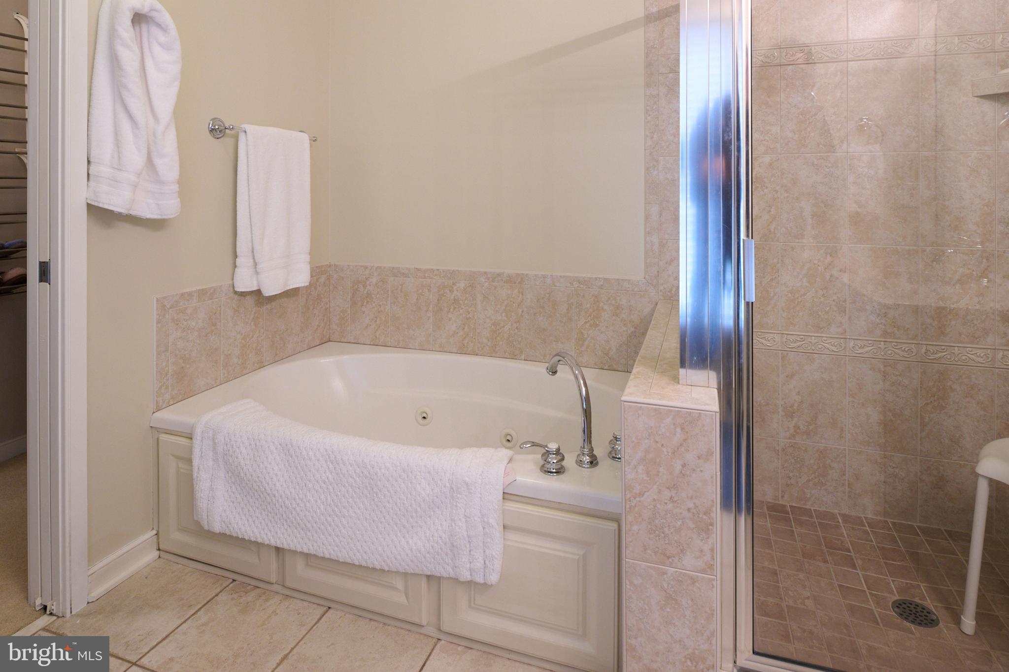 3296 Shellers Bend, Unit 144 State College, PA 16801 - Photo 27 of 48 a bath tub sitting next to a shower