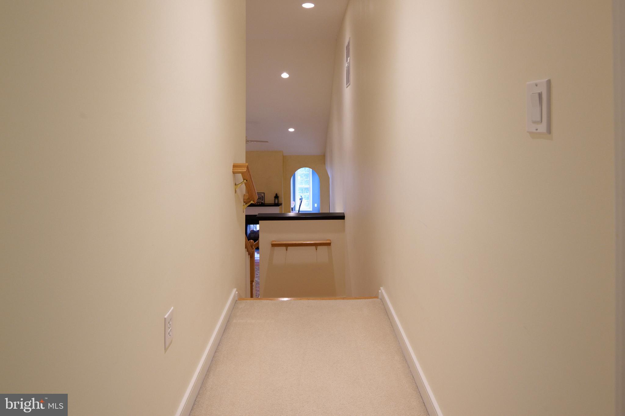 3296 Shellers Bend, Unit 144 State College, PA 16801 - Photo 28 of 48 a view of a hallway with wooden floor