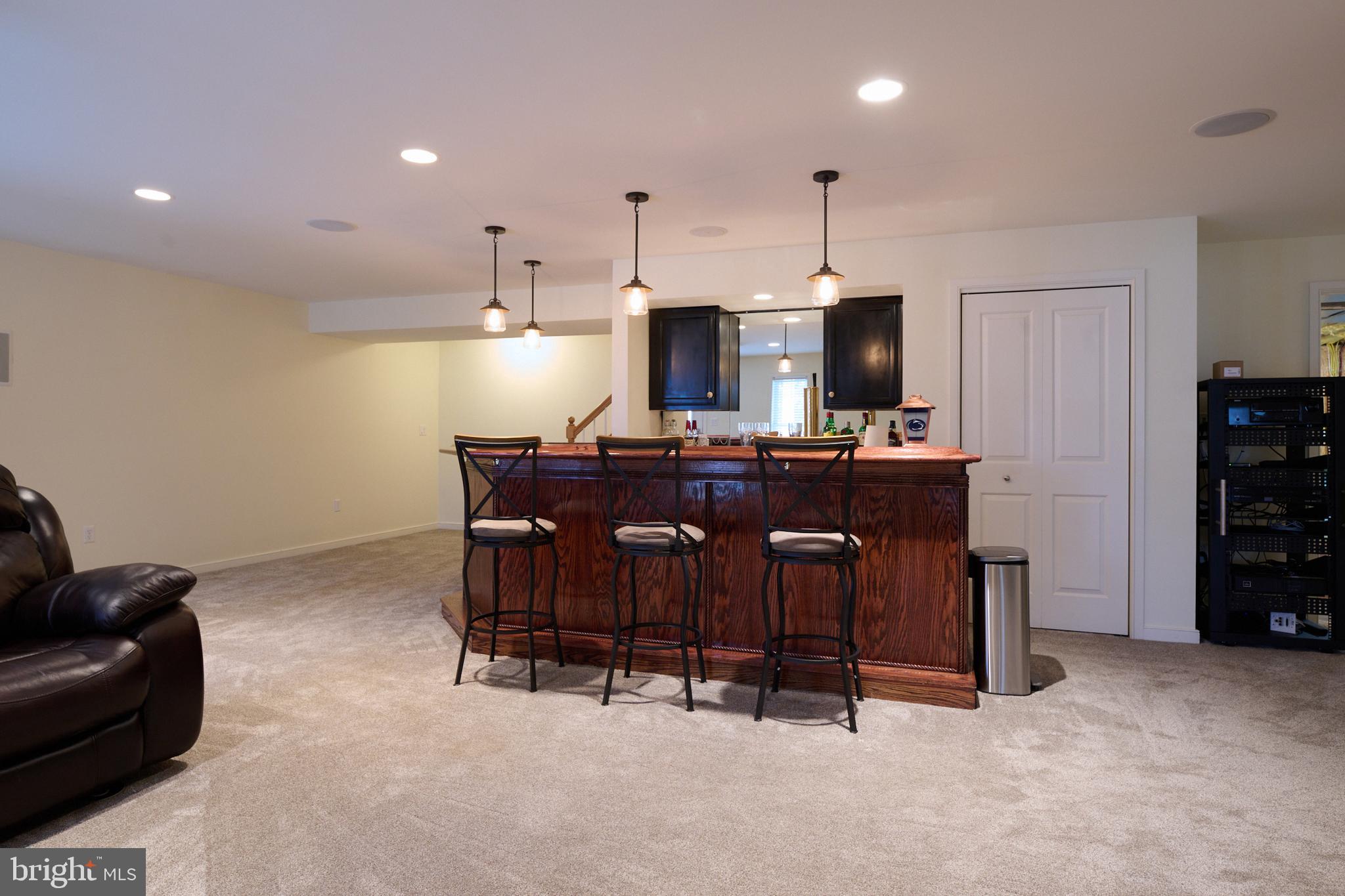 3296 Shellers Bend, Unit 144 State College, PA 16801 - Photo 33 of 48 a living room with furniture a dining table and kitchen view