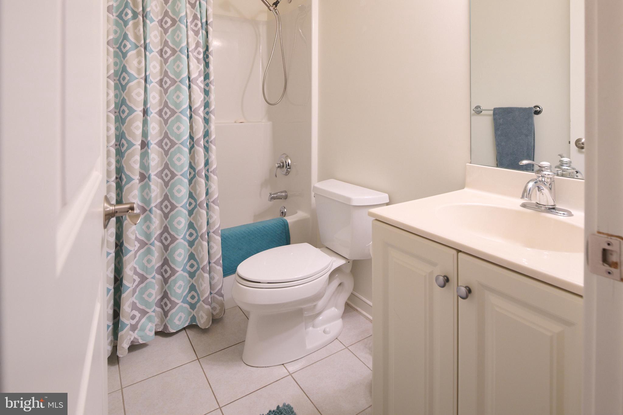 3296 Shellers Bend, Unit 144 State College, PA 16801 - Photo 38 of 48 a white toilet sitting next to a bathroom sink
