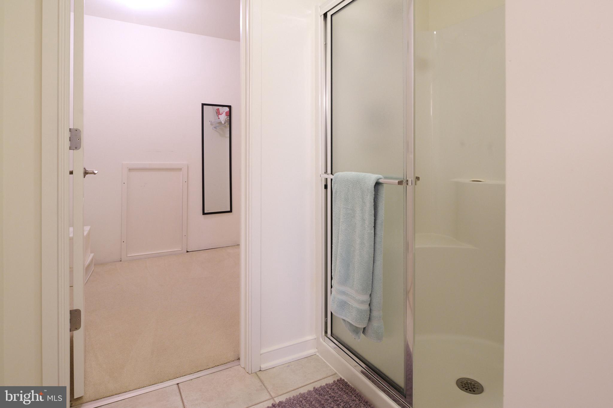 3296 Shellers Bend, Unit 144 State College, PA 16801 - Photo 40 of 48 a bathroom with a glass shower door