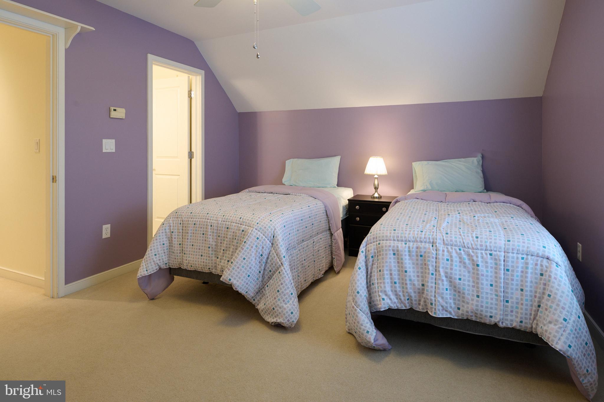 3296 Shellers Bend, Unit 144 State College, PA 16801 - Photo 41 of 48 a bedroom with two beds and lamp