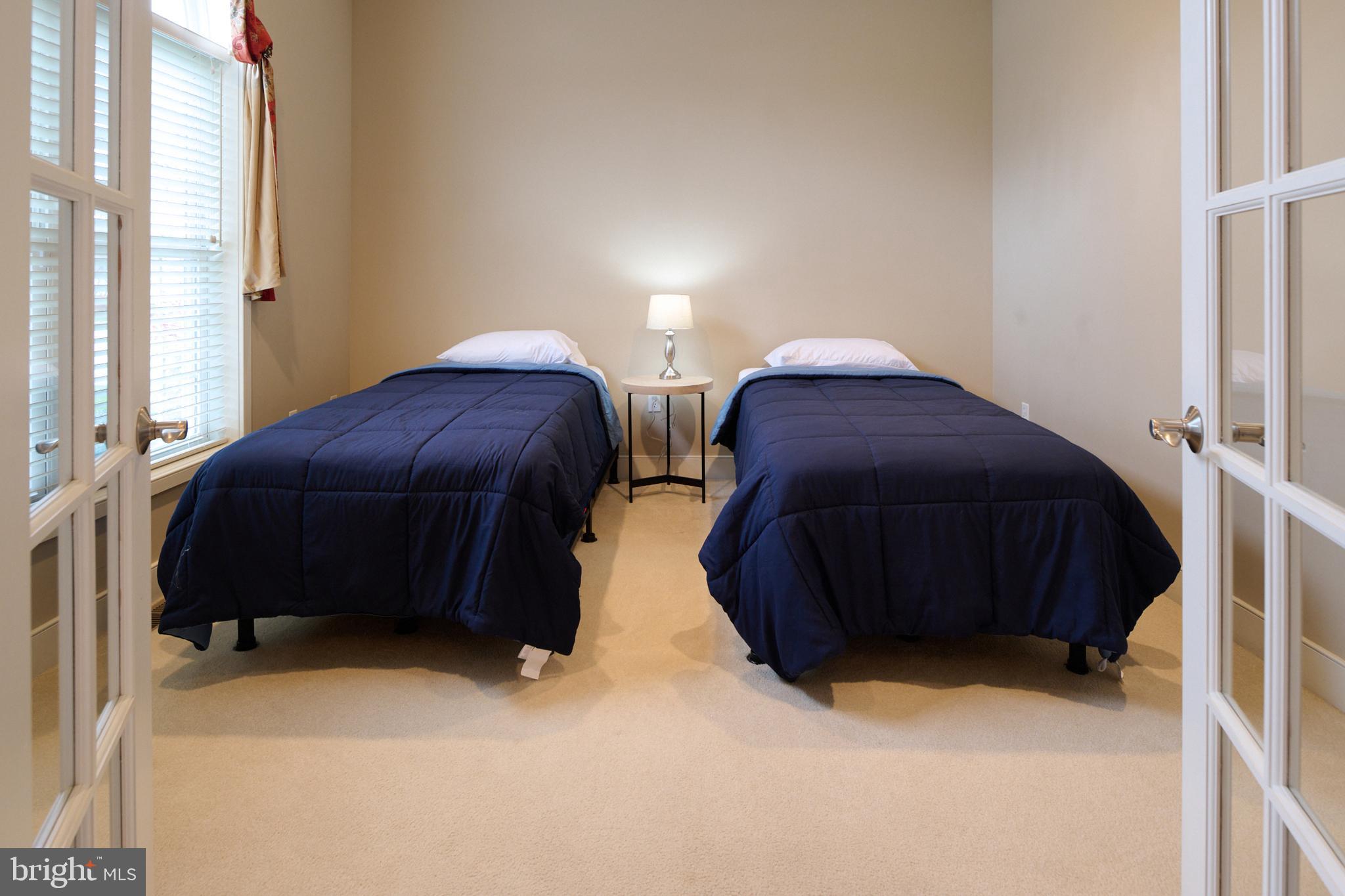 3296 Shellers Bend, Unit 144 State College, PA 16801 - Photo 43 of 48 a bedroom with two bed and a closet