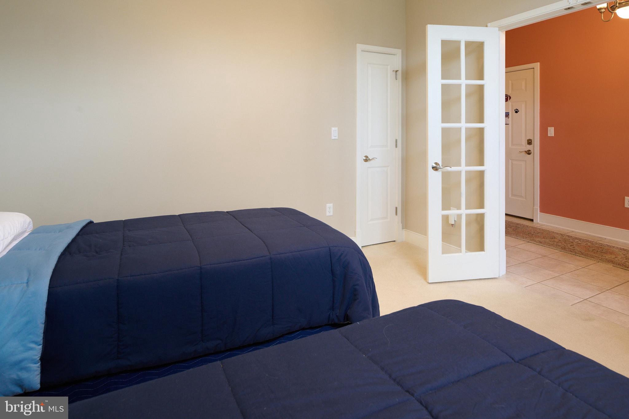 3296 Shellers Bend, Unit 144 State College, PA 16801 - Photo 44 of 48 a bedroom with a bed and a cabinet