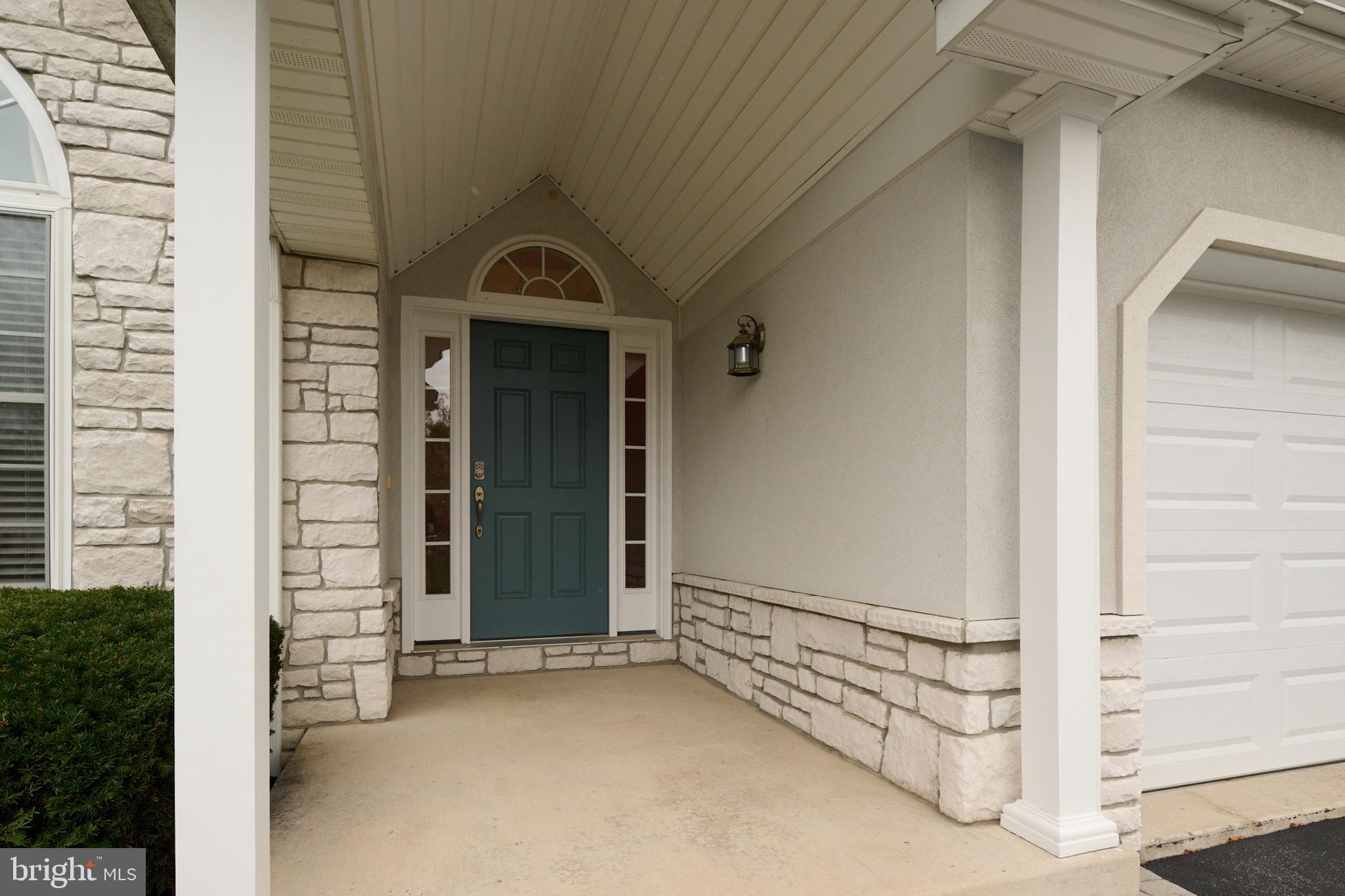 3296 Shellers Bend, Unit 144 State College, PA 16801 - Photo 5 of 48 a view of a wooden door of the house
