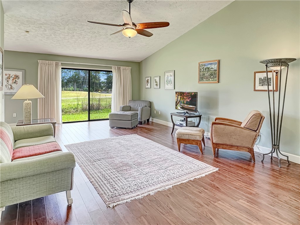 5408 Eagle Drive Fort Pierce, FL 34951 - Photo 13 of 35 a living room with furniture and a rug