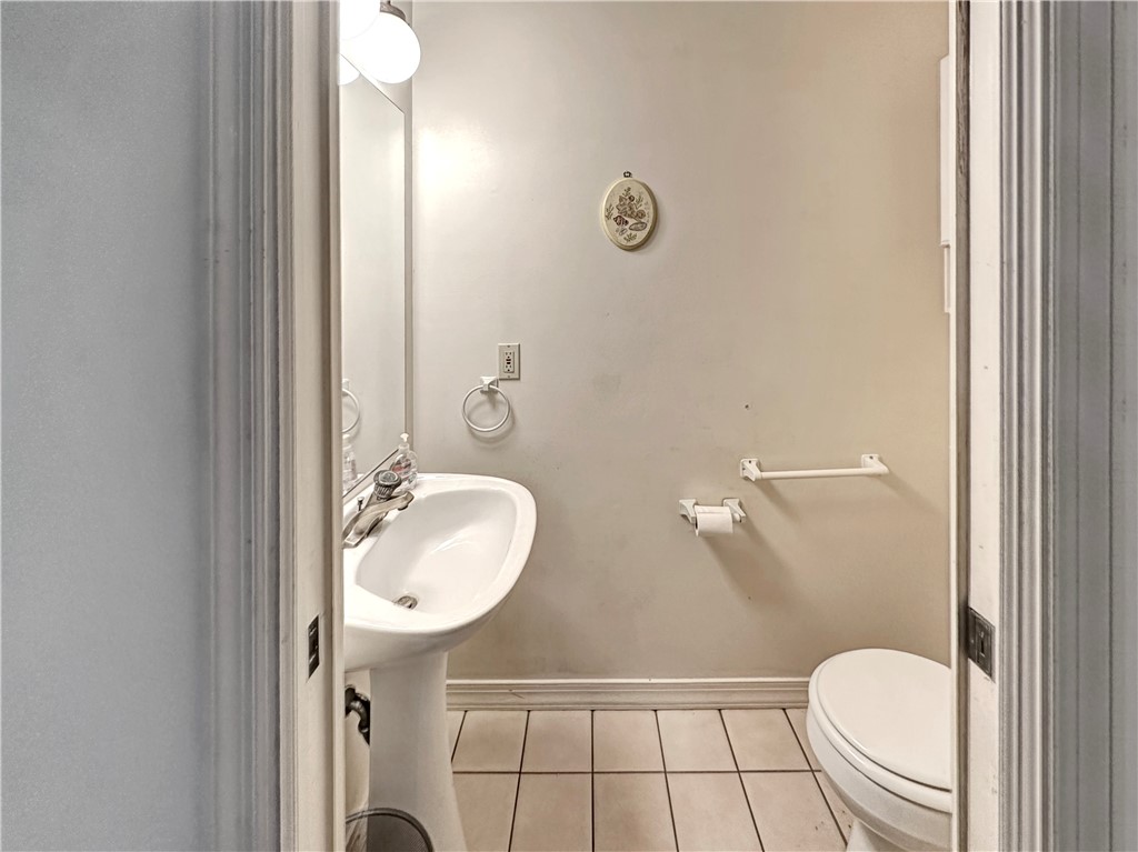 5408 Eagle Drive Fort Pierce, FL 34951 - Photo 29 of 35 a bathroom with a toilet a sink and mirror